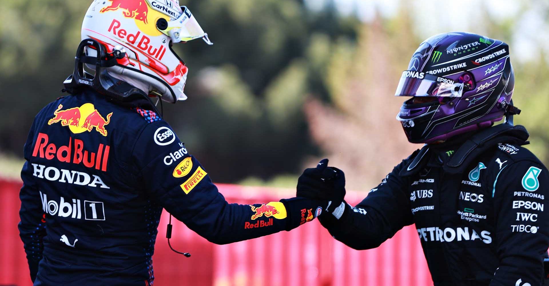 BARCELONA, SPAIN - MAY 08: Pole position qualifier Lewis Hamilton of Great Britain and Mercedes GP shakes hands with second place qualifier Max Verstappen of Netherlands and Red Bull Racing in parc ferme during qualifying for the F1 Grand Prix of Spain at Circuit de Barcelona-Catalunya on May 08, 2021 in Barcelona, Spain. (Photo by Mark Thompson/Getty Images)