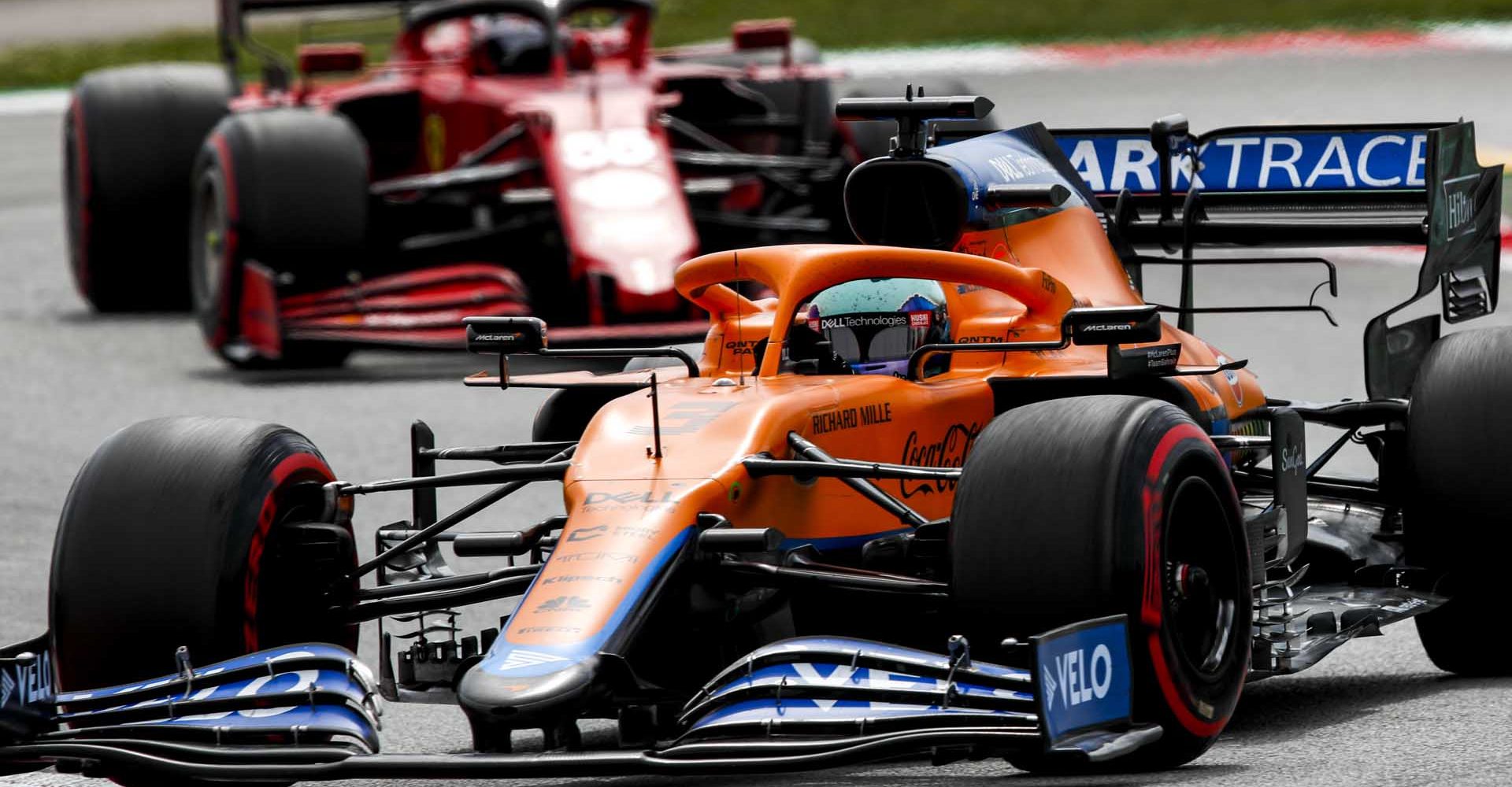 Daniel Ricciardo, McLaren MCL35M, leads Carlos Sainz, Ferrari SF21 entering corner