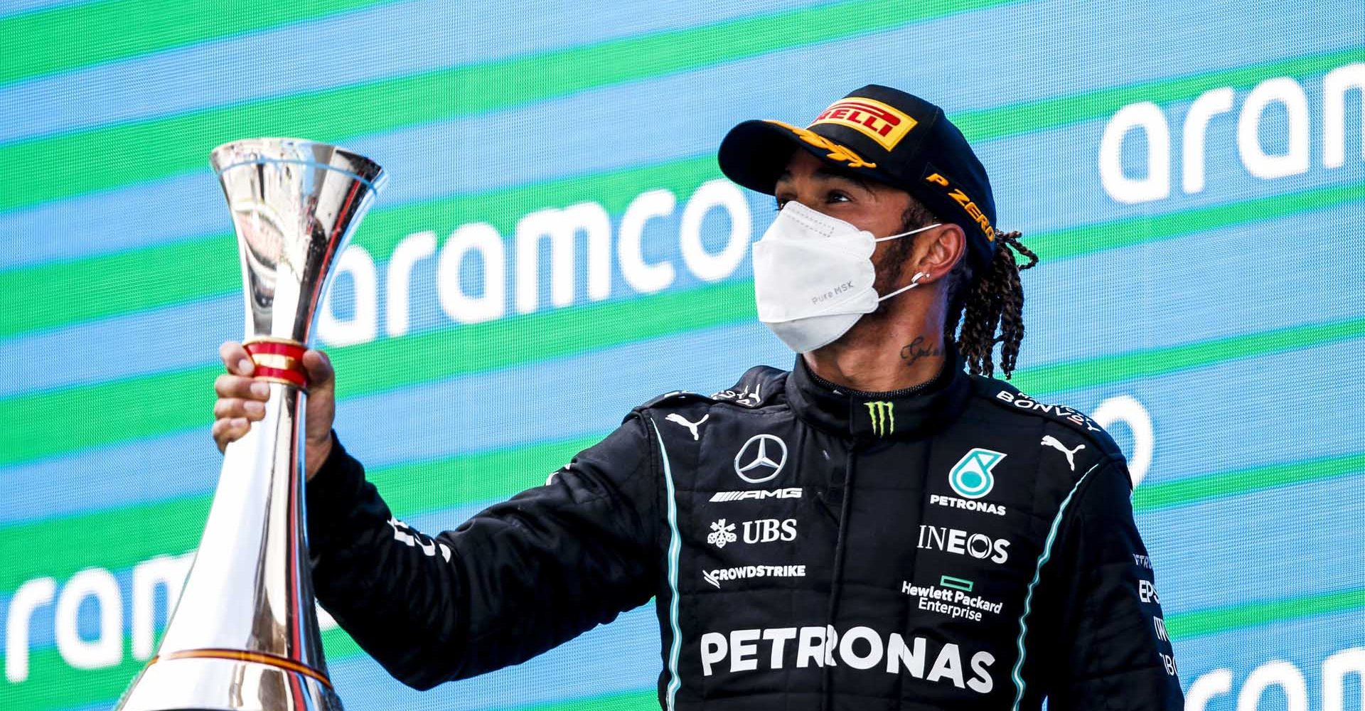 CIRCUIT DE BARCELONA-CATALUNYA, SPAIN - MAY 09: Race Winner Sir Lewis Hamilton, Mercedes celebrates on the podium with the trophy during the Spanish GP at Circuit de Barcelona-Catalunya on Sunday May 09, 2021 in Barcelona, Spain. (Photo by Charles Coates / LAT Images)