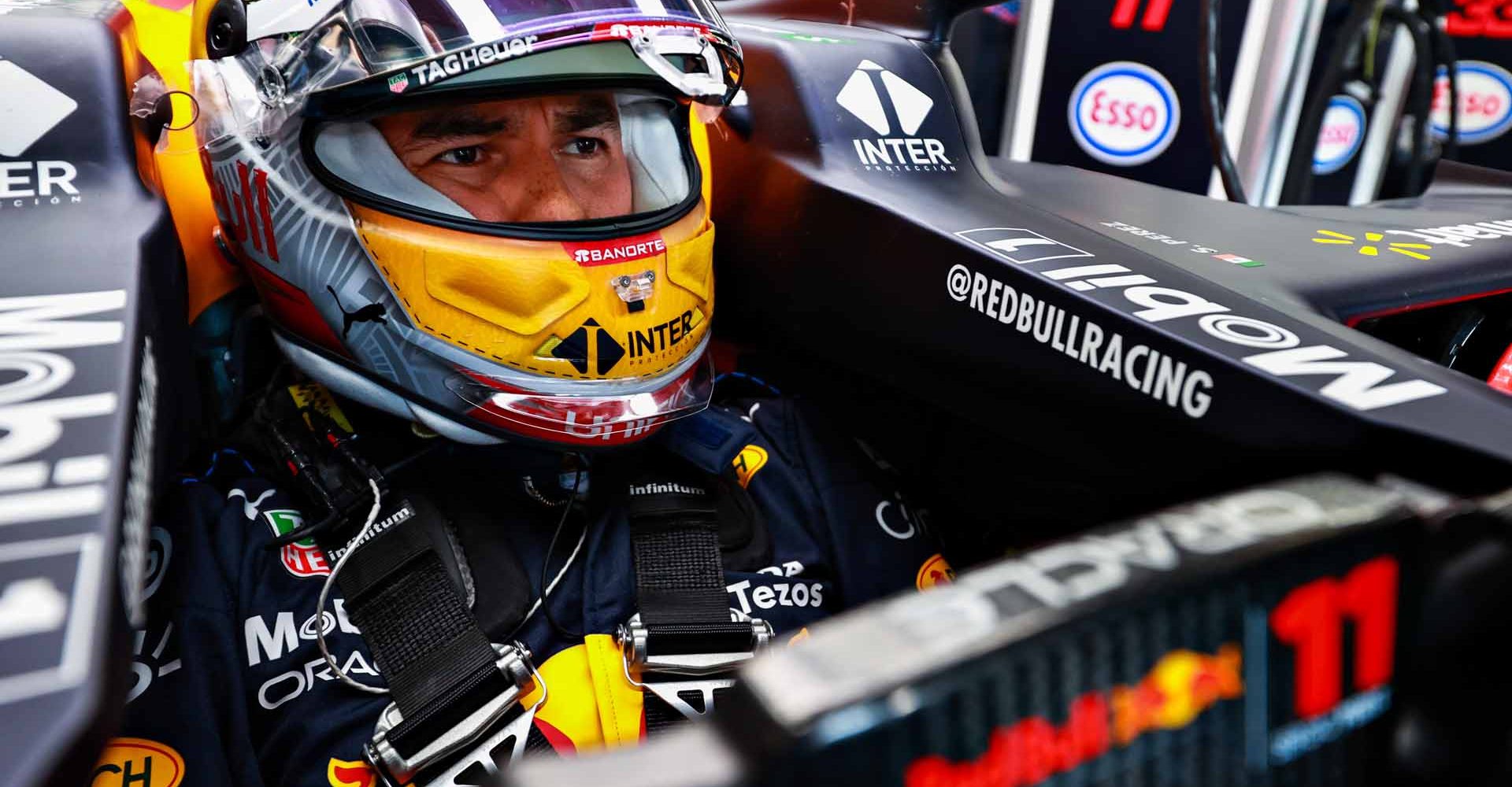 SPIELBERG, AUSTRIA - JUNE 25: Sergio Perez of Mexico and Red Bull Racing looks on from his car in the garage during practice ahead of the F1 Grand Prix of Styria at Red Bull Ring on June 25, 2021 in Spielberg, Austria. (Photo by Mark Thompson/Getty Images)