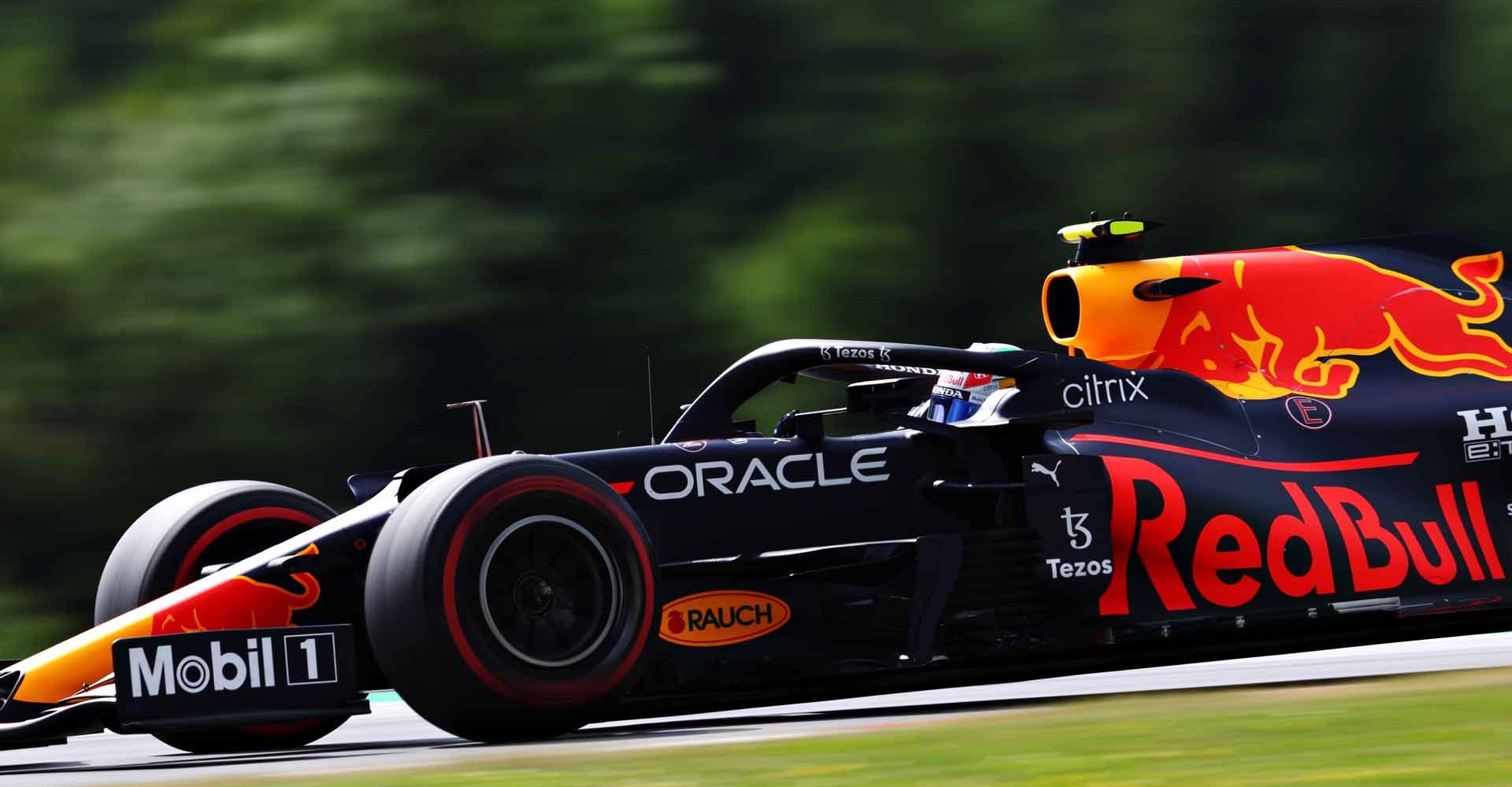 SPIELBERG, AUSTRIA - JUNE 25: Sergio Perez of Mexico driving the (11) Red Bull Racing RB16B Honda on track during practice ahead of the F1 Grand Prix of Styria at Red Bull Ring on June 25, 2021 in Spielberg, Austria. (Photo by Clive Rose/Getty Images)