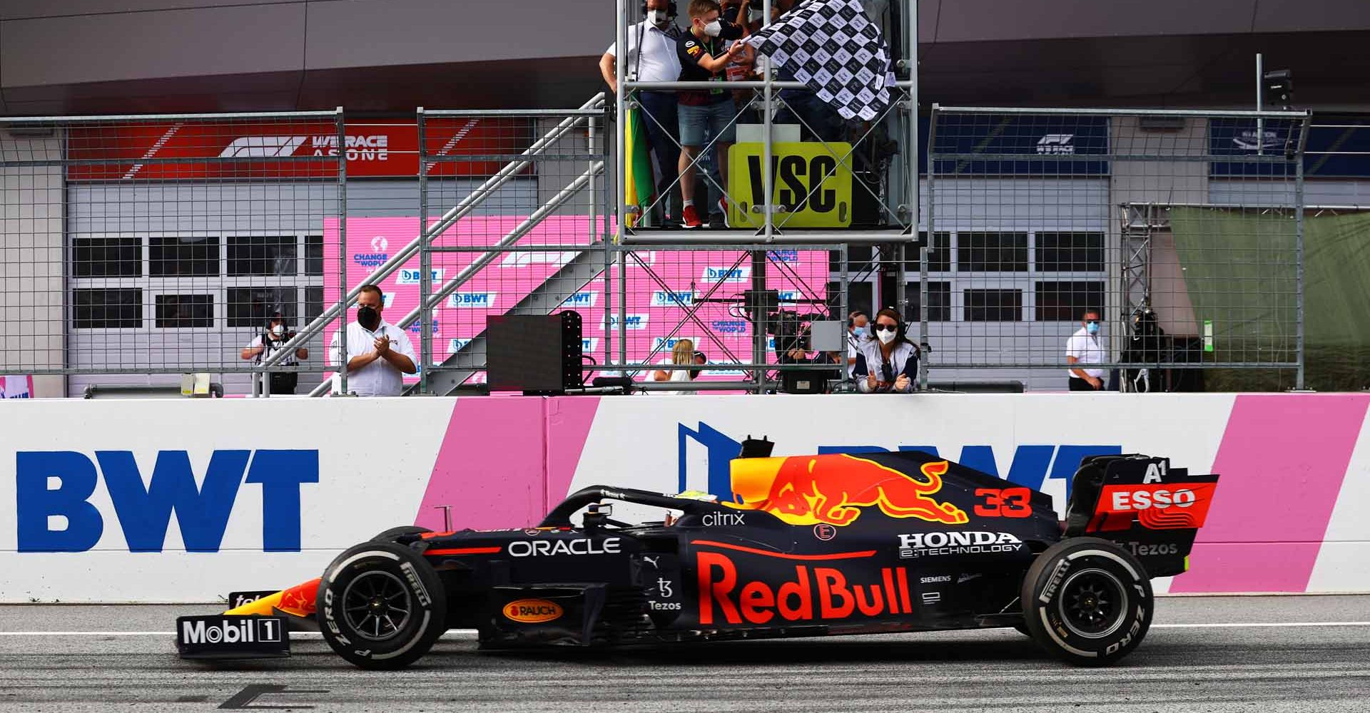 SPIELBERG, AUSTRIA - JUNE 27: Race winner Max Verstappen of the Netherlands driving the (33) Red Bull Racing RB16B Honda takes the chequered flag during the F1 Grand Prix of Styria at Red Bull Ring on June 27, 2021 in Spielberg, Austria. (Photo by Bryn Lennon/Getty Images)