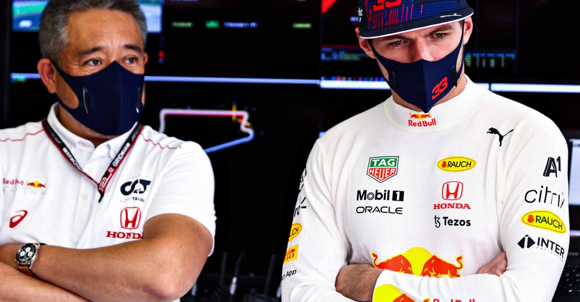 ISTANBUL, TURKEY - OCTOBER 08: Max Verstappen of Netherlands and Red Bull Racing and Masashi Yamamoto of Honda look on in the garage during practice ahead of the F1 Grand Prix of Turkey at Intercity Istanbul Park on October 08, 2021 in Istanbul, Turkey. (Photo by Mark Thompson/Getty Images)