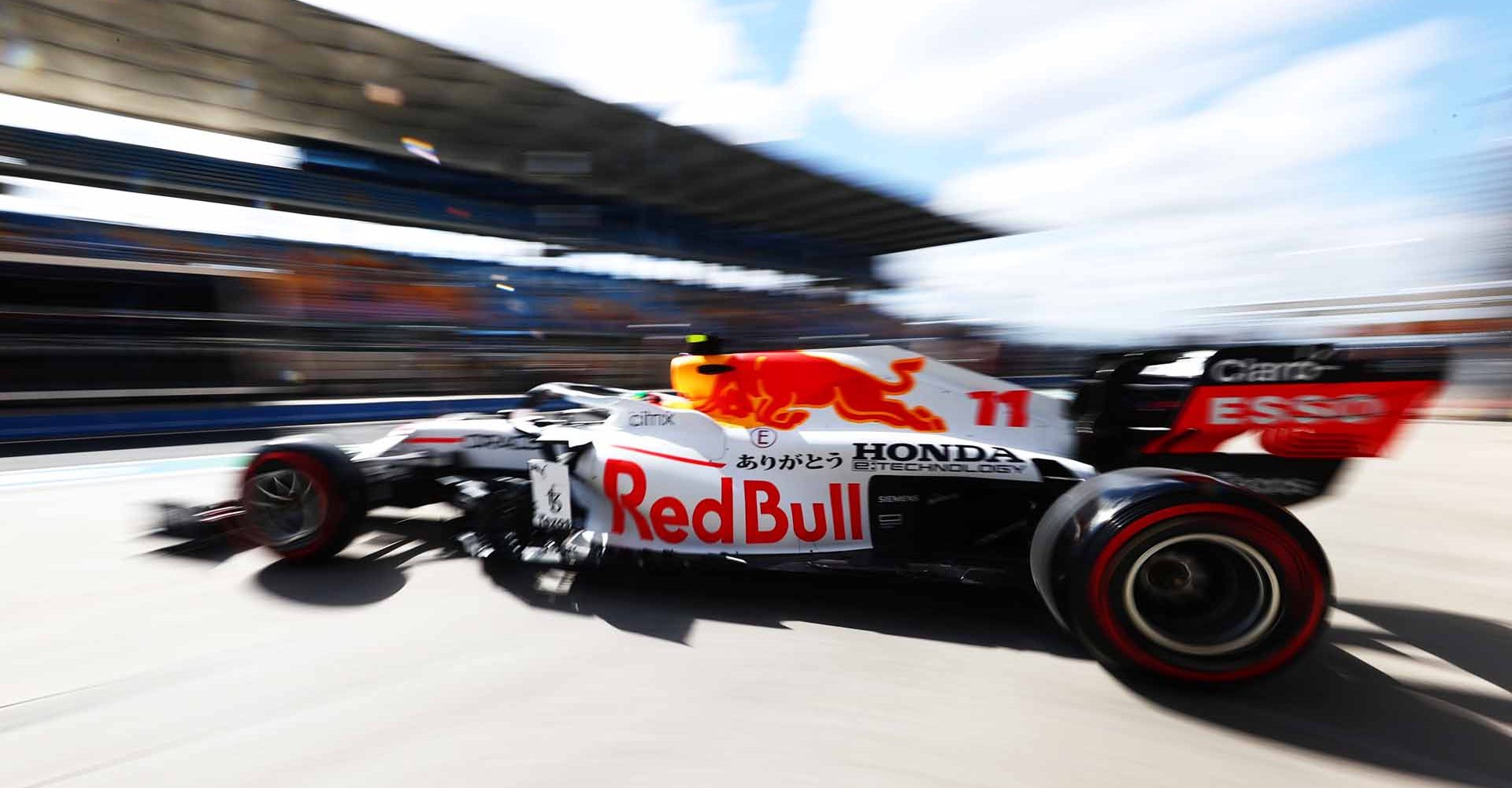 ISTANBUL, TURKEY - OCTOBER 08: Sergio Perez of Mexico driving the (11) Red Bull Racing RB16B Honda leaves the garage during practice ahead of the F1 Grand Prix of Turkey at Intercity Istanbul Park on October 08, 2021 in Istanbul, Turkey. (Photo by Mark Thompson/Getty Images)