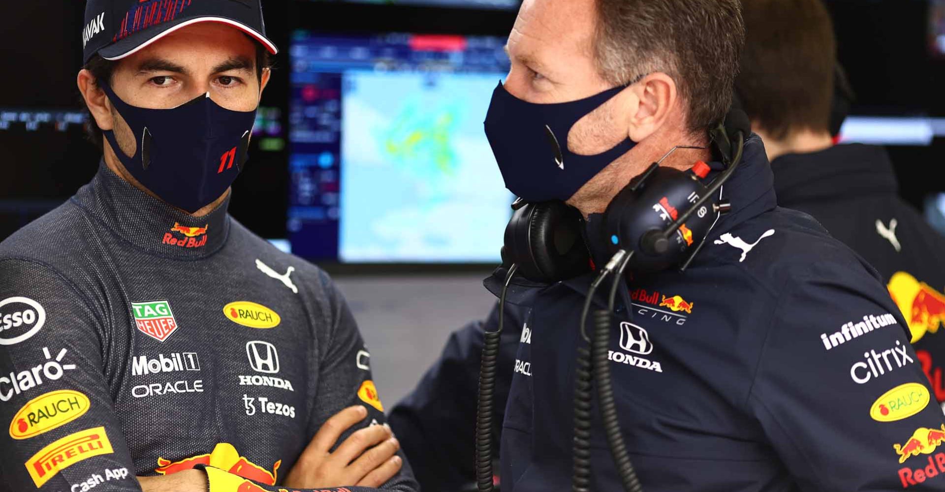 ISTANBUL, TURKEY - OCTOBER 09: Sergio Perez of Mexico and Red Bull Racing and Red Bull Racing Team Principal Christian Horner talk in the garage during final practice ahead of the F1 Grand Prix of Turkey at Intercity Istanbul Park on October 09, 2021 in Istanbul, Turkey. (Photo by Mark Thompson/Getty Images)