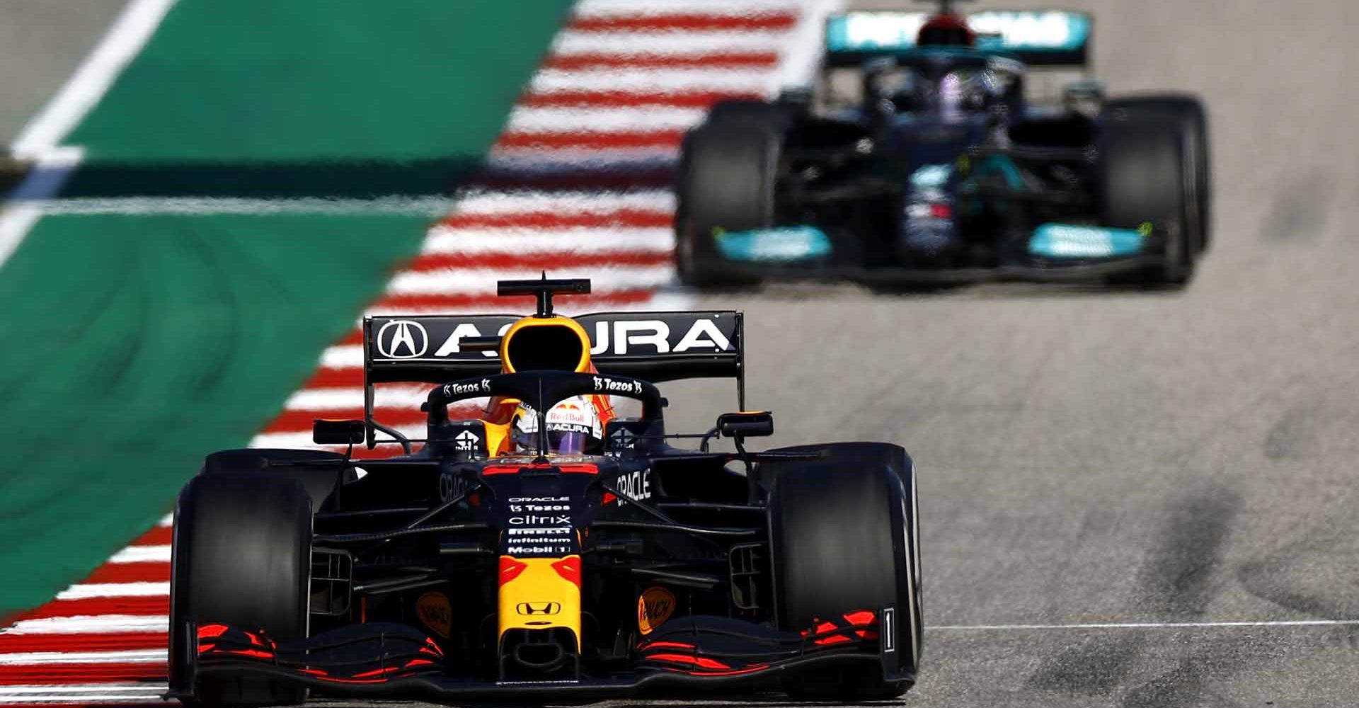 AUSTIN, TEXAS - OCTOBER 24: Max Verstappen of the Netherlands driving the (33) Red Bull Racing RB16B Honda leads Lewis Hamilton of Great Britain driving the (44) Mercedes AMG Petronas F1 Team Mercedes W12 during the F1 Grand Prix of USA at Circuit of The Americas on October 24, 2021 in Austin, Texas. (Photo by Jared C. Tilton/Getty Images)