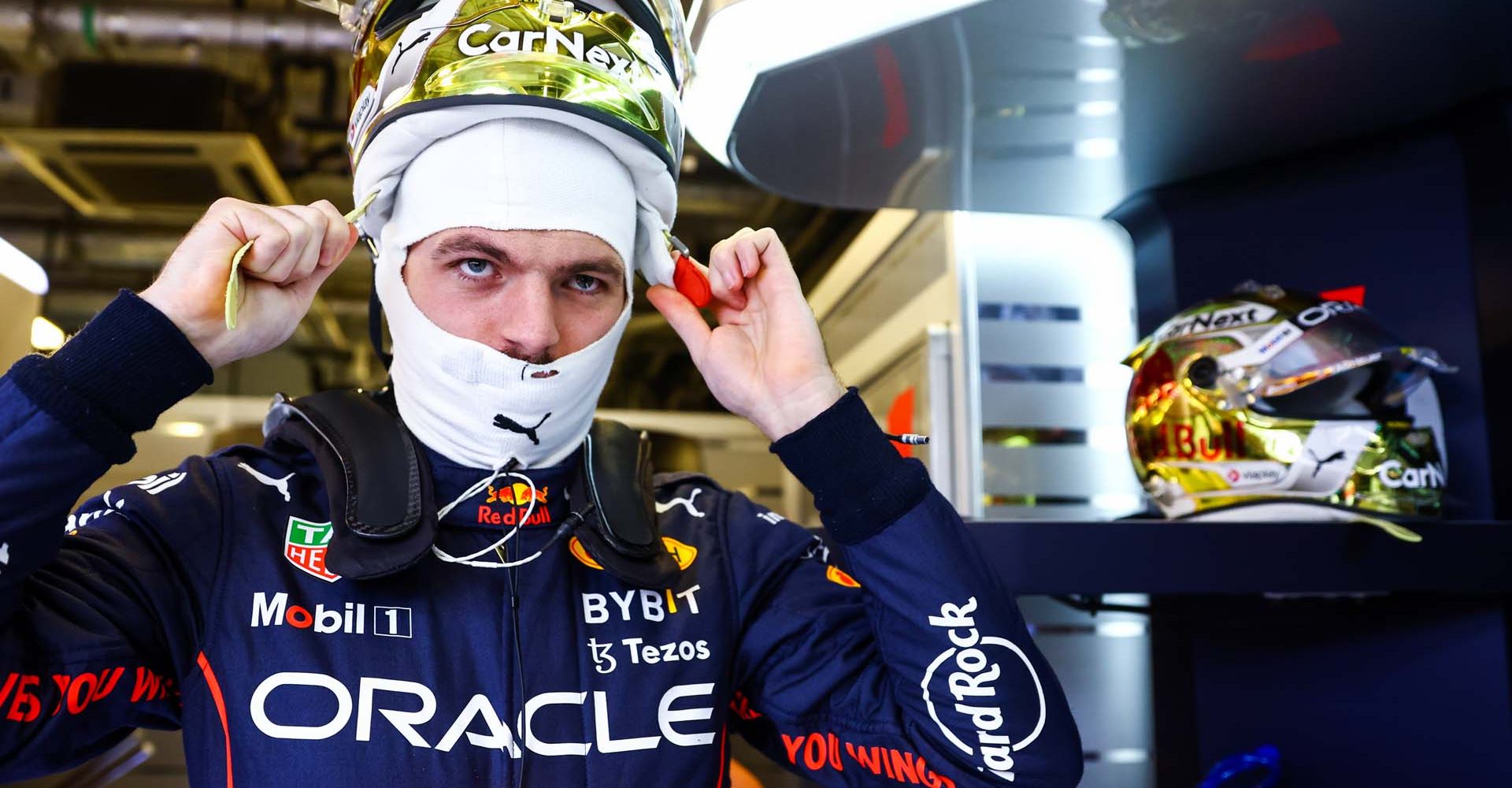 ABU DHABI, UNITED ARAB EMIRATES - NOVEMBER 18: Max Verstappen of the Netherlands and Oracle Red Bull Racing prepares to drive in the garage during practice ahead of the F1 Grand Prix of Abu Dhabi at Yas Marina Circuit on November 18, 2022 in Abu Dhabi, United Arab Emirates. (Photo by Mark Thompson/Getty Images)