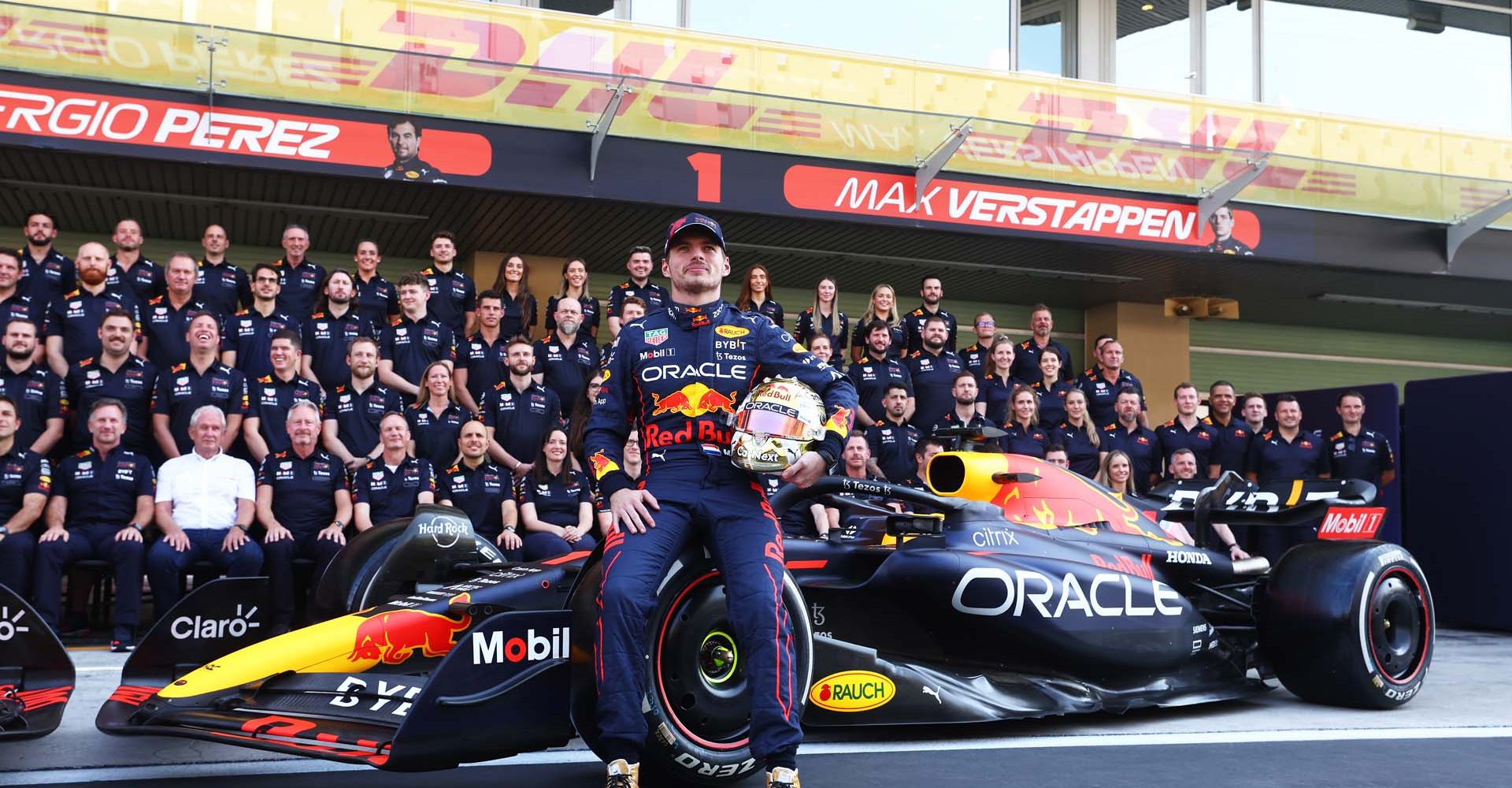 ABU DHABI, UNITED ARAB EMIRATES - NOVEMBER 17: Max Verstappen of the Netherlands and Oracle Red Bull Racing poses with his team at the Red Bull Racing End of Season Team Photo during previews ahead of the F1 Grand Prix of Abu Dhabi at Yas Marina Circuit on November 17, 2022 in Abu Dhabi, United Arab Emirates. (Photo by Bryn Lennon/Getty Images)