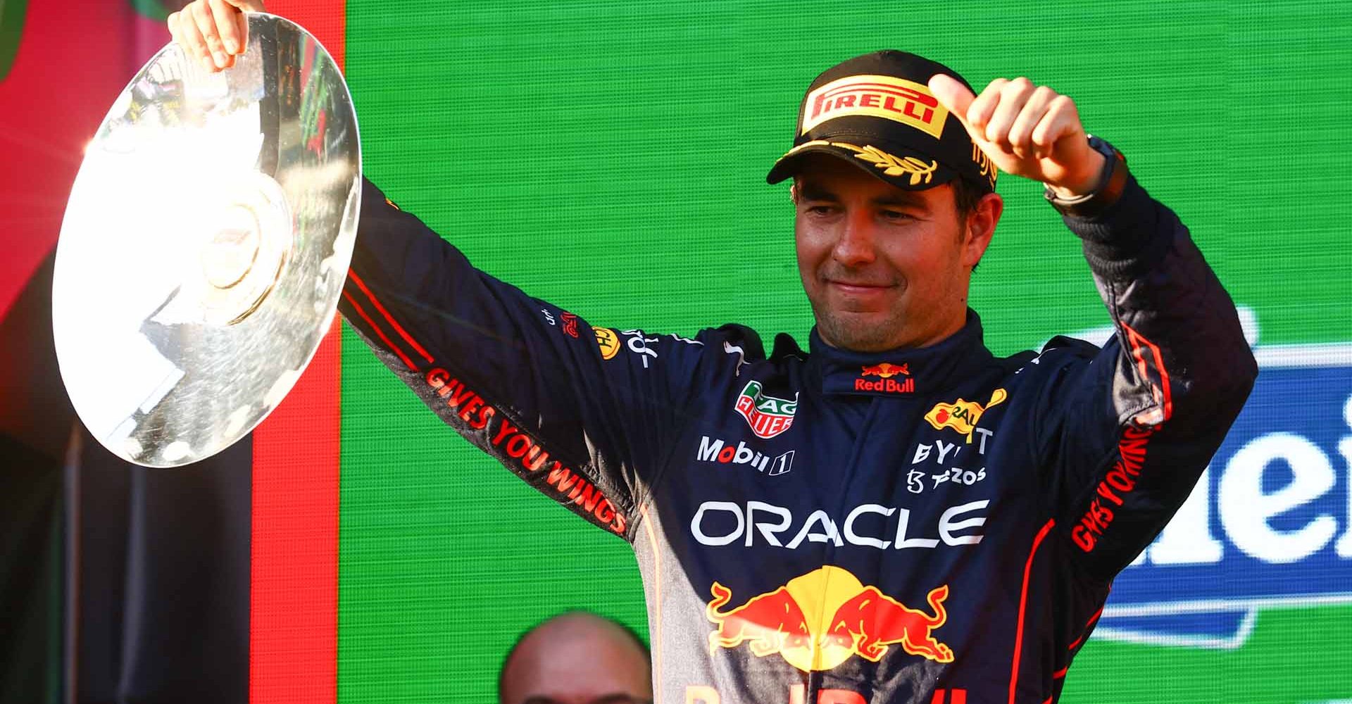 MELBOURNE, AUSTRALIA - APRIL 10: Second placed Sergio Perez of Mexico and Oracle Red Bull Racing celebrates on the podium during the F1 Grand Prix of Australia at Melbourne Grand Prix Circuit on April 10, 2022 in Melbourne, Australia. (Photo by Mark Thompson/Getty Images)