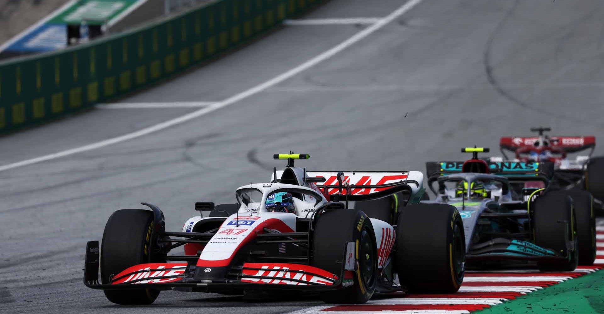 RED BULL RING, AUSTRIA - JULY 09: Mick Schumacher, Haas VF-22, leads Sir Lewis Hamilton, Mercedes W13 during the Austrian GP at Red Bull Ring on Saturday July 09, 2022 in Spielberg, Austria. (Photo by Glenn Dunbar / LAT Images)