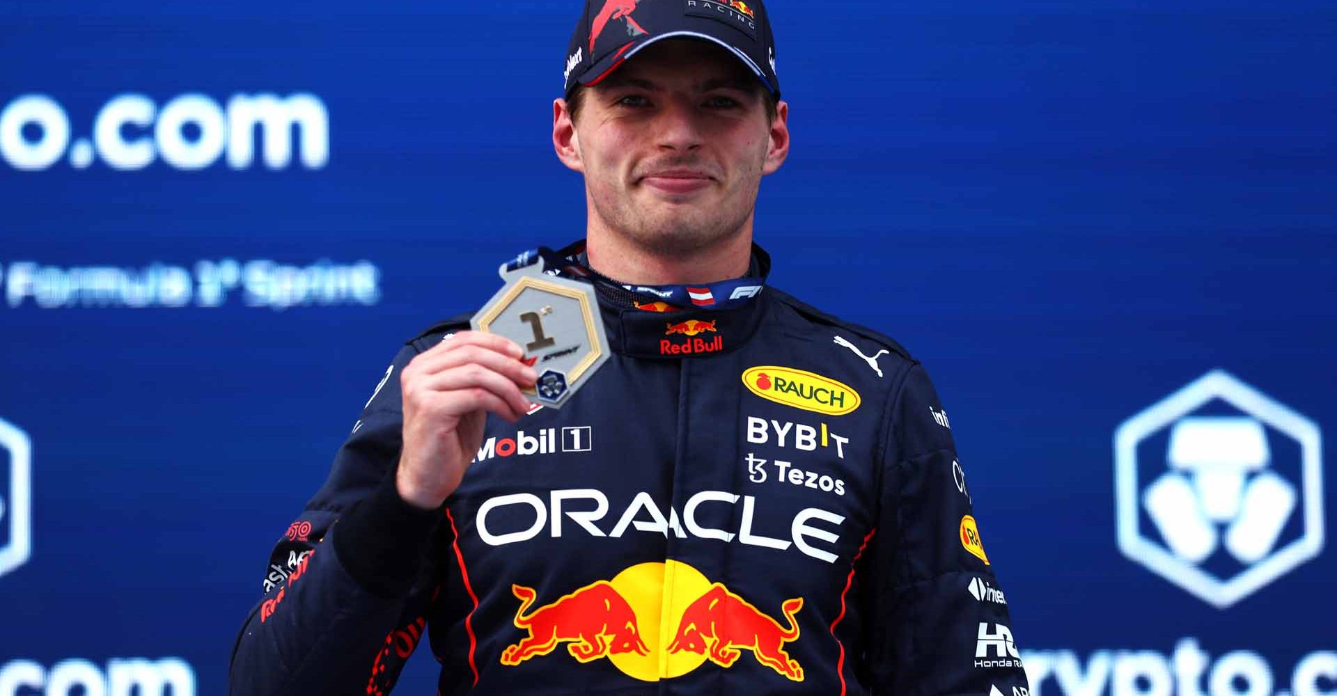 SPIELBERG, AUSTRIA - JULY 09: Sprint winner Max Verstappen of the Netherlands and Oracle Red Bull Racing celebrates with his medal during the F1 Grand Prix of Austria Sprint at Red Bull Ring on July 09, 2022 in Spielberg, Austria. (Photo by Bryn Lennon/Getty Images)