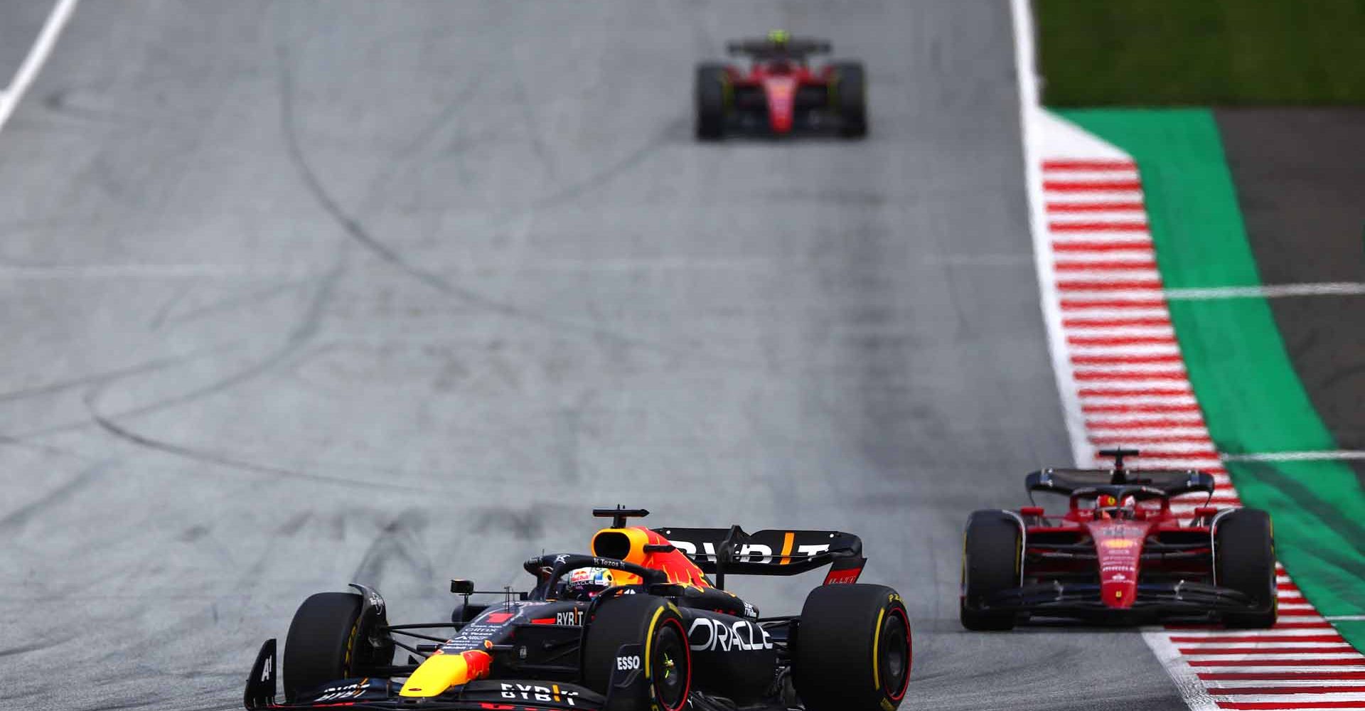 SPIELBERG, AUSTRIA - JULY 10: Max Verstappen of the Netherlands driving the (1) Oracle Red Bull Racing RB18 leads Charles Leclerc of Monaco driving the (16) Ferrari F1-75 during the F1 Grand Prix of Austria at Red Bull Ring on July 10, 2022 in Spielberg, Austria. (Photo by Bryn Lennon/Getty Images)