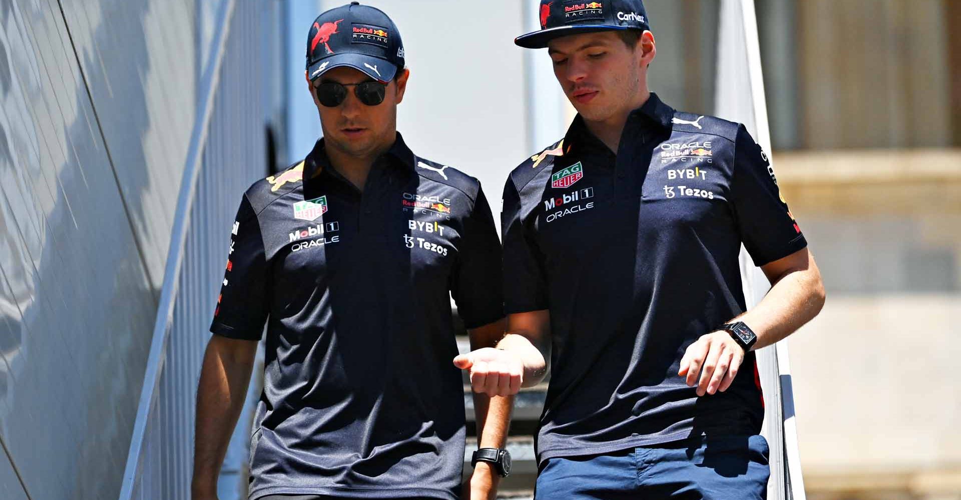 BAKU, AZERBAIJAN - JUNE 11: Sergio Perez of Mexico and Oracle Red Bull Racing and Max Verstappen of the Netherlands and Oracle Red Bull Racing walk in the Paddock prior to final practice ahead of the F1 Grand Prix of Azerbaijan at Baku City Circuit on June 11, 2022 in Baku, Azerbaijan. (Photo by Dan Mullan/Getty Images)