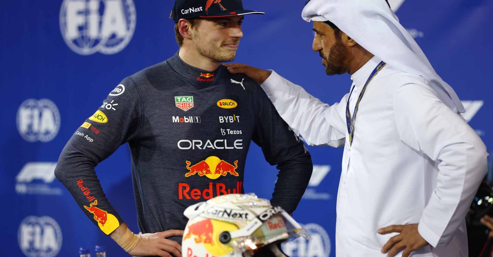 BAHRAIN, BAHRAIN - MARCH 19: Second place qualifier Max Verstappen of the Netherlands and Oracle Red Bull Racing talks with Mohammed ben Sulayem, FIA President, in parc ferme during qualifying ahead of the F1 Grand Prix of Bahrain at Bahrain International Circuit on March 19, 2022 in Bahrain, Bahrain. (Photo by Lars Baron/Getty Images)