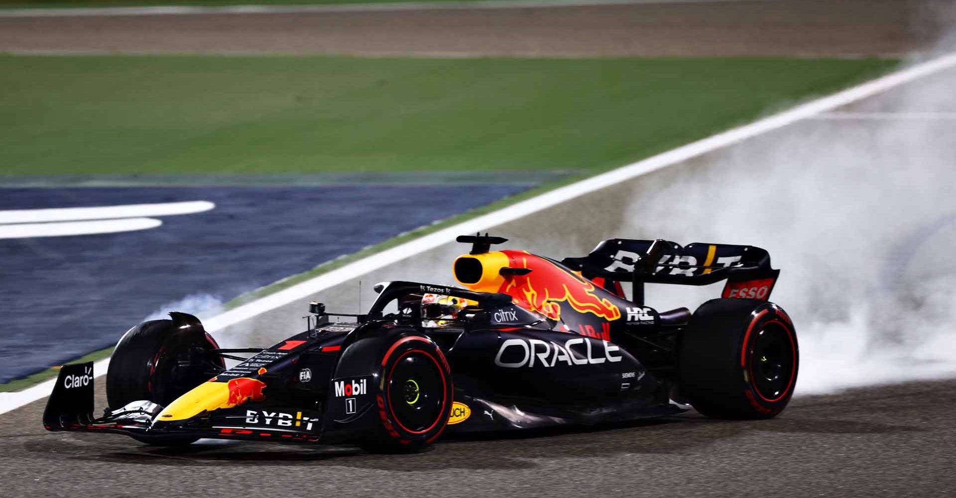 BAHRAIN, BAHRAIN - MARCH 20: Max Verstappen of the Netherlands driving the (1) Oracle Red Bull Racing RB18 locks a wheel under braking during the F1 Grand Prix of Bahrain at Bahrain International Circuit on March 20, 2022 in Bahrain, Bahrain. (Photo by Mark Thompson/Getty Images)