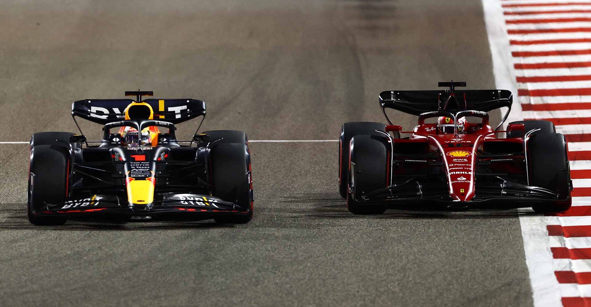 BAHRAIN, BAHRAIN - MARCH 20: Max Verstappen of the Netherlands driving the (1) Oracle Red Bull Racing RB18 and Charles Leclerc of Monaco driving (16) the Ferrari F1-75 battle for track position during the F1 Grand Prix of Bahrain at Bahrain International Circuit on March 20, 2022 in Bahrain, Bahrain. (Photo by Mark Thompson/Getty Images)