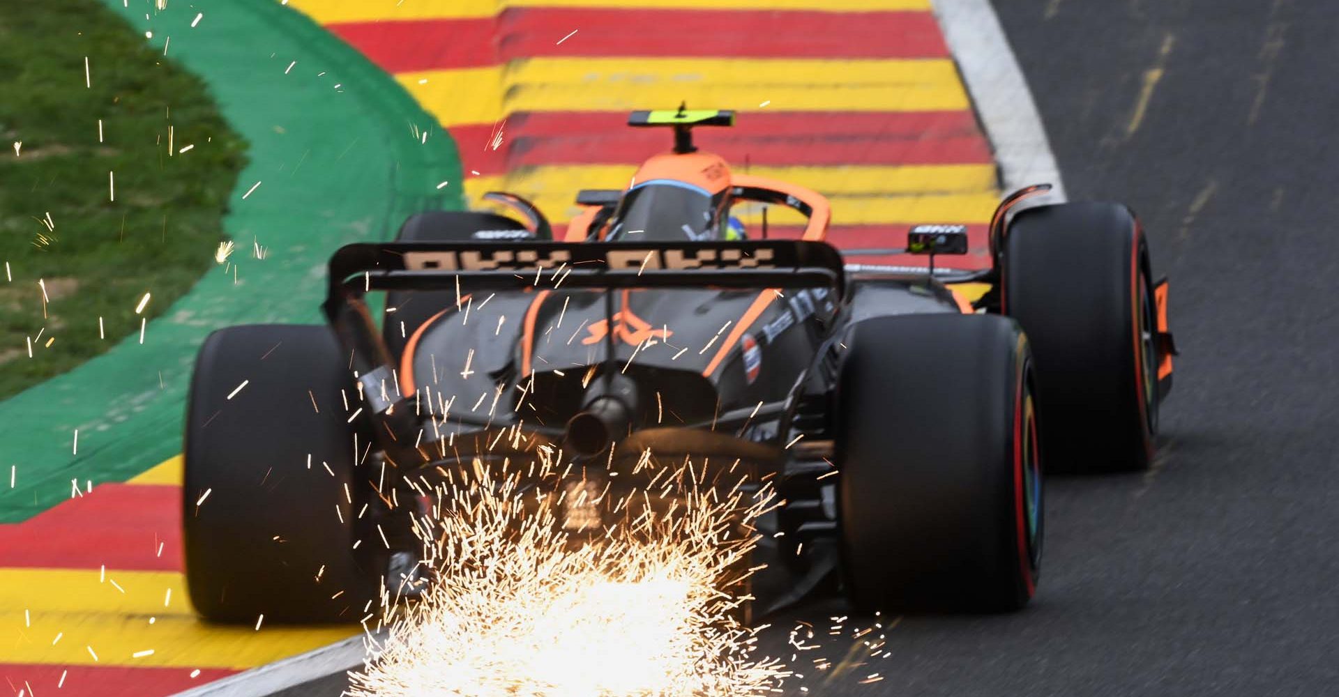 Sparks trail from Lando Norris, McLaren MCL36 from rear