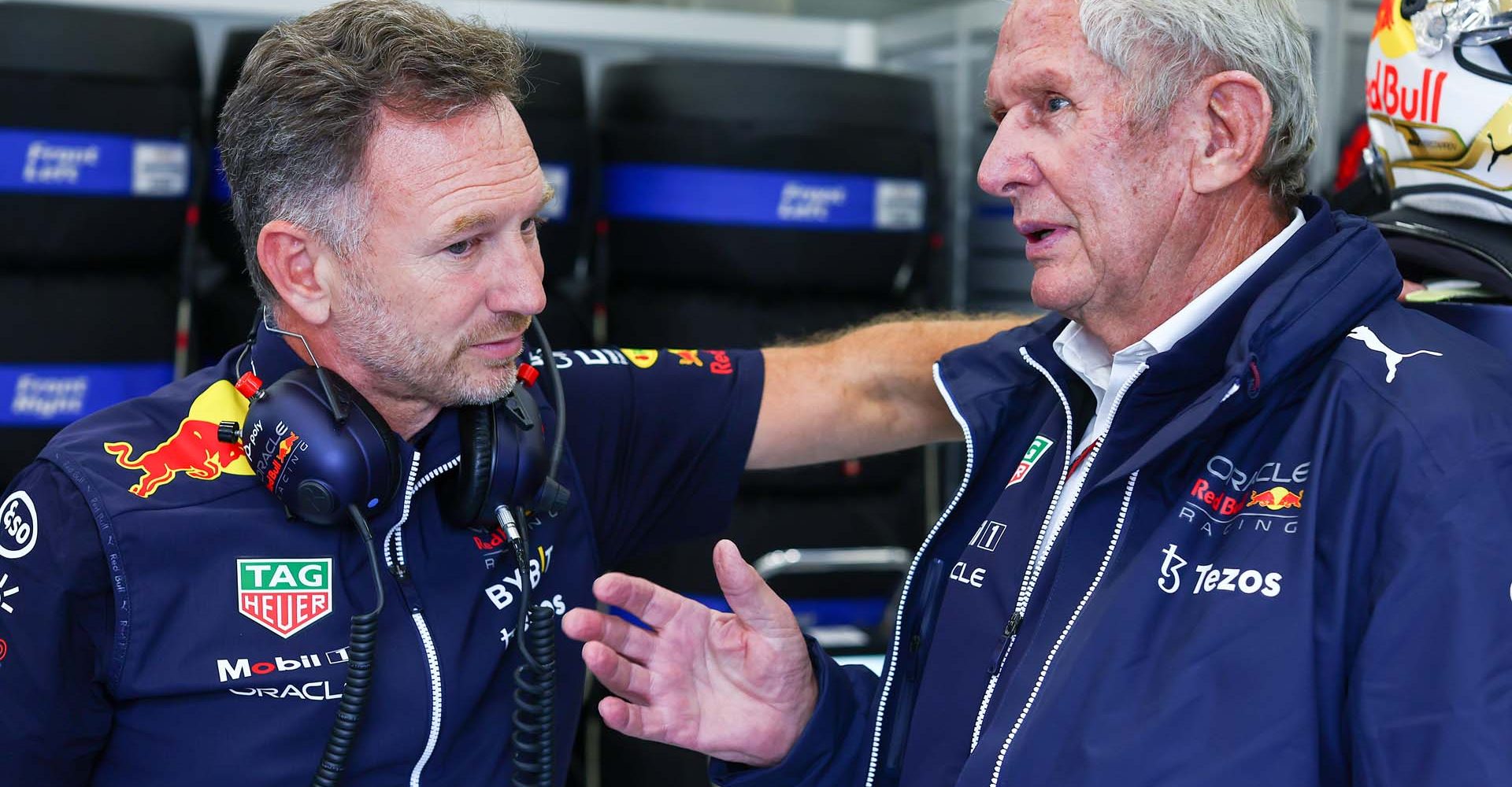 SPA, BELGIUM - AUGUST 27: Red Bull Racing Team Principal Christian Horner talks with Red Bull Racing Team Consultant Dr Helmut Marko in the garage during qualifying ahead of the F1 Grand Prix of Belgium at Circuit de Spa-Francorchamps on August 27, 2022 in Spa, Belgium. (Photo by Mark Thompson/Getty Images)