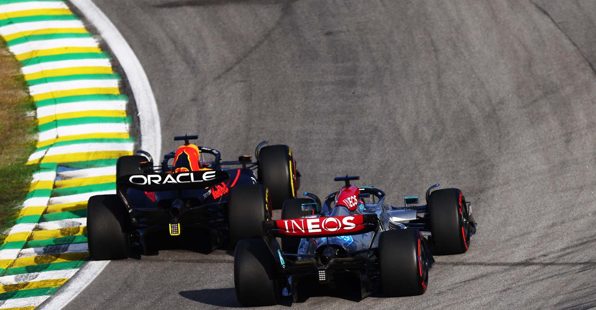 SAO PAULO, BRAZIL - NOVEMBER 12: Max Verstappen of the Netherlands driving the (1) Oracle Red Bull Racing RB18 leads George Russell of Great Britain driving the (63) Mercedes AMG Petronas F1 Team W13 during the Sprint ahead of the F1 Grand Prix of Brazil at Autodromo Jose Carlos Pace on November 12, 2022 in Sao Paulo, Brazil. (Photo by Mark Thompson/Getty Images)