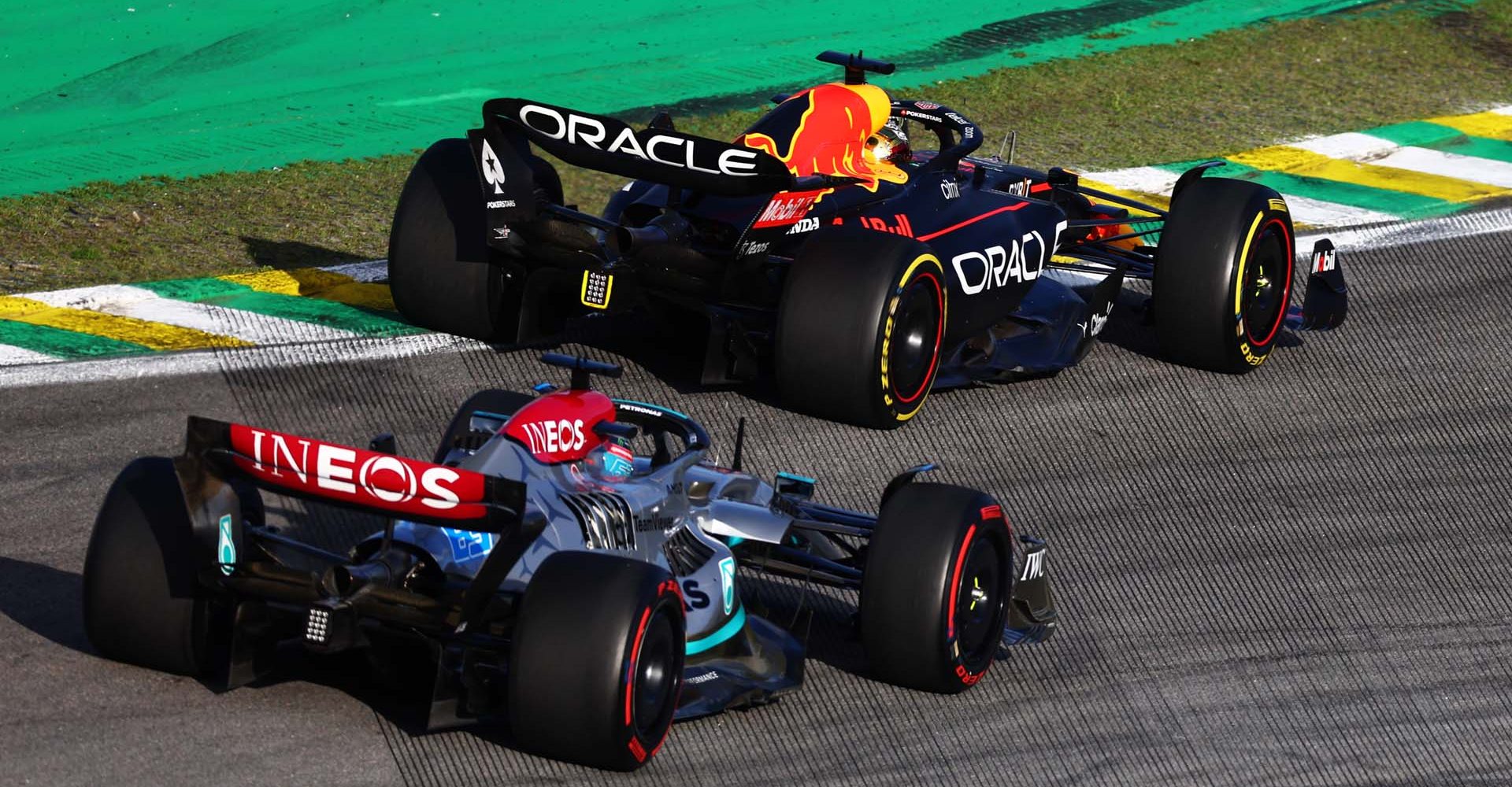 SAO PAULO, BRAZIL - NOVEMBER 12: Max Verstappen of the Netherlands driving the (1) Oracle Red Bull Racing RB18 leads George Russell of Great Britain driving the (63) Mercedes AMG Petronas F1 Team W13 during the Sprint ahead of the F1 Grand Prix of Brazil at Autodromo Jose Carlos Pace on November 12, 2022 in Sao Paulo, Brazil. (Photo by Mark Thompson/Getty Images)