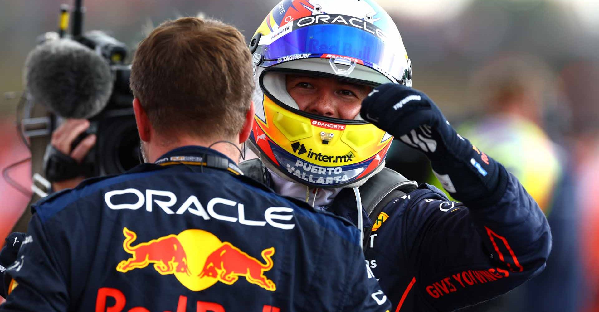 NORTHAMPTON, ENGLAND - JULY 03: Second placed Sergio Perez of Mexico driving the (11) Oracle Red Bull Racing RB18 celebrates in parc ferme during the F1 Grand Prix of Great Britain at Silverstone on July 03, 2022 in Northampton, England. (Photo by Mark Thompson/Getty Images)