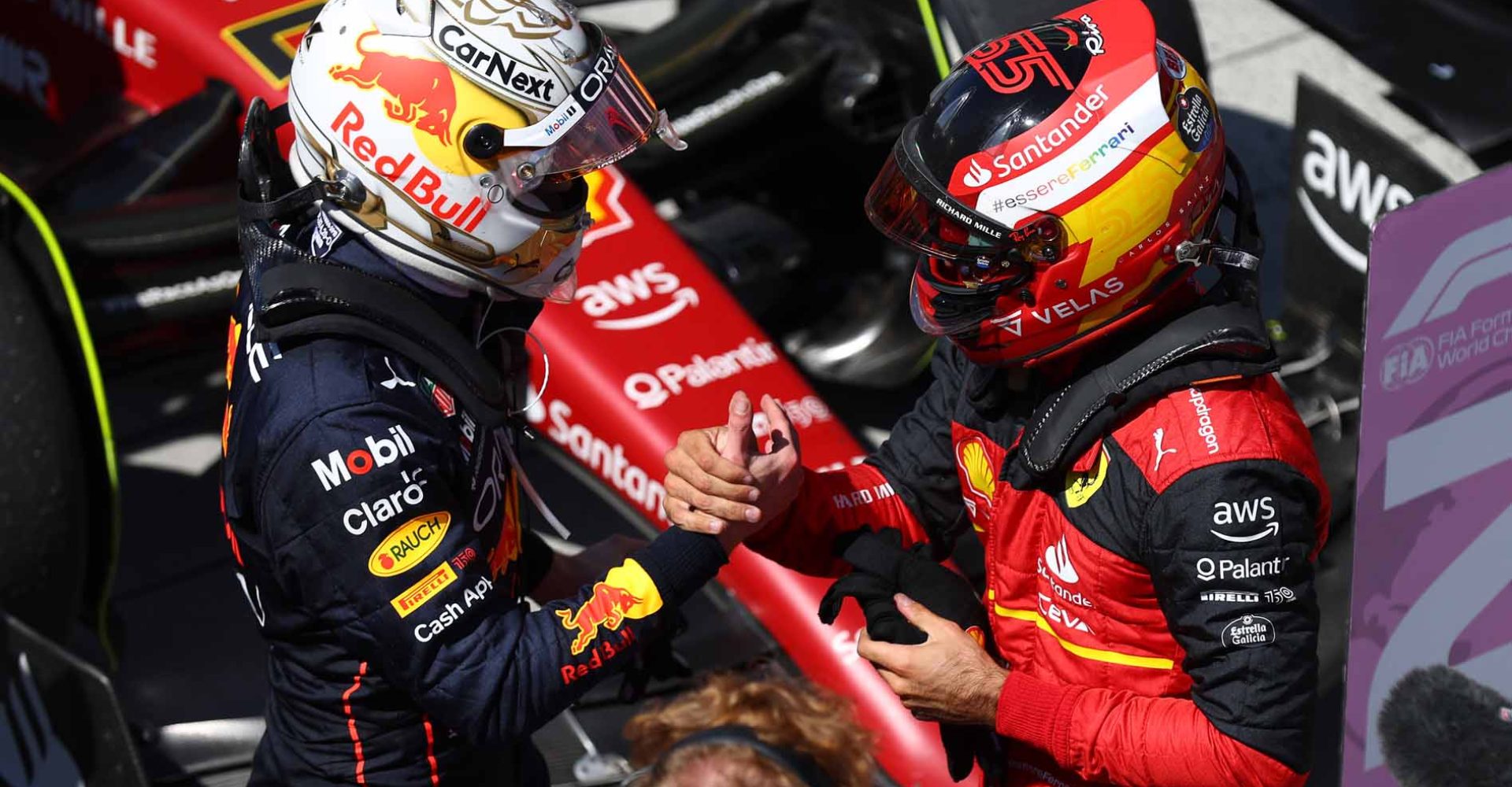 MONTREAL, QUEBEC - JUNE 19: Race winner Max Verstappen of the Netherlands and Oracle Red Bull Racing talks with Second placed Carlos Sainz of Spain and Ferrari in parc ferme during the F1 Grand Prix of Canada at Circuit Gilles Villeneuve on June 19, 2022 in Montreal, Quebec. (Photo by Clive Rose/Getty Images)