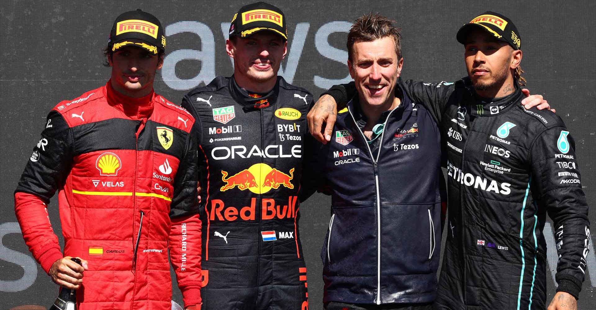 MONTREAL, QUEBEC - JUNE 19: Race winner Max Verstappen of the Netherlands and Oracle Red Bull Racing (second from left), Second placed Carlos Sainz of Spain and Ferrari (L), Third placed Lewis Hamilton of Great Britain and Mercedes (R) and Ben Gordon-Smith of Red Bull Racing (second from right) celebrate on the podium during the F1 Grand Prix of Canada at Circuit Gilles Villeneuve on June 19, 2022 in Montreal, Quebec. (Photo by Clive Rose/Getty Images)