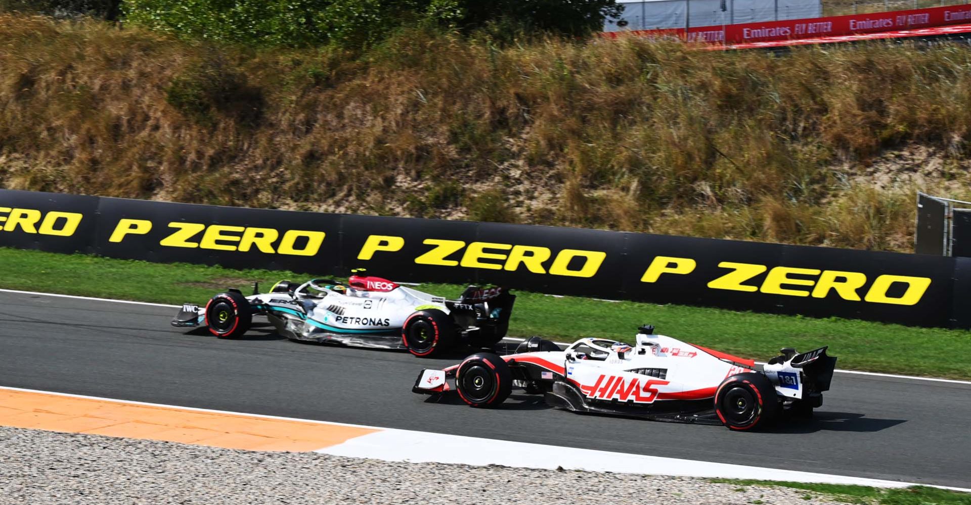 CIRCUIT ZANDVOORT, NETHERLANDS - SEPTEMBER 02: Sir Lewis Hamilton, Mercedes W13, leads Kevin Magnussen, Haas VF-22 during the Dutch GP at Circuit Zandvoort on Friday September 02, 2022 in North Holland, Netherlands. (Photo by Mark Sutton / LAT Images)