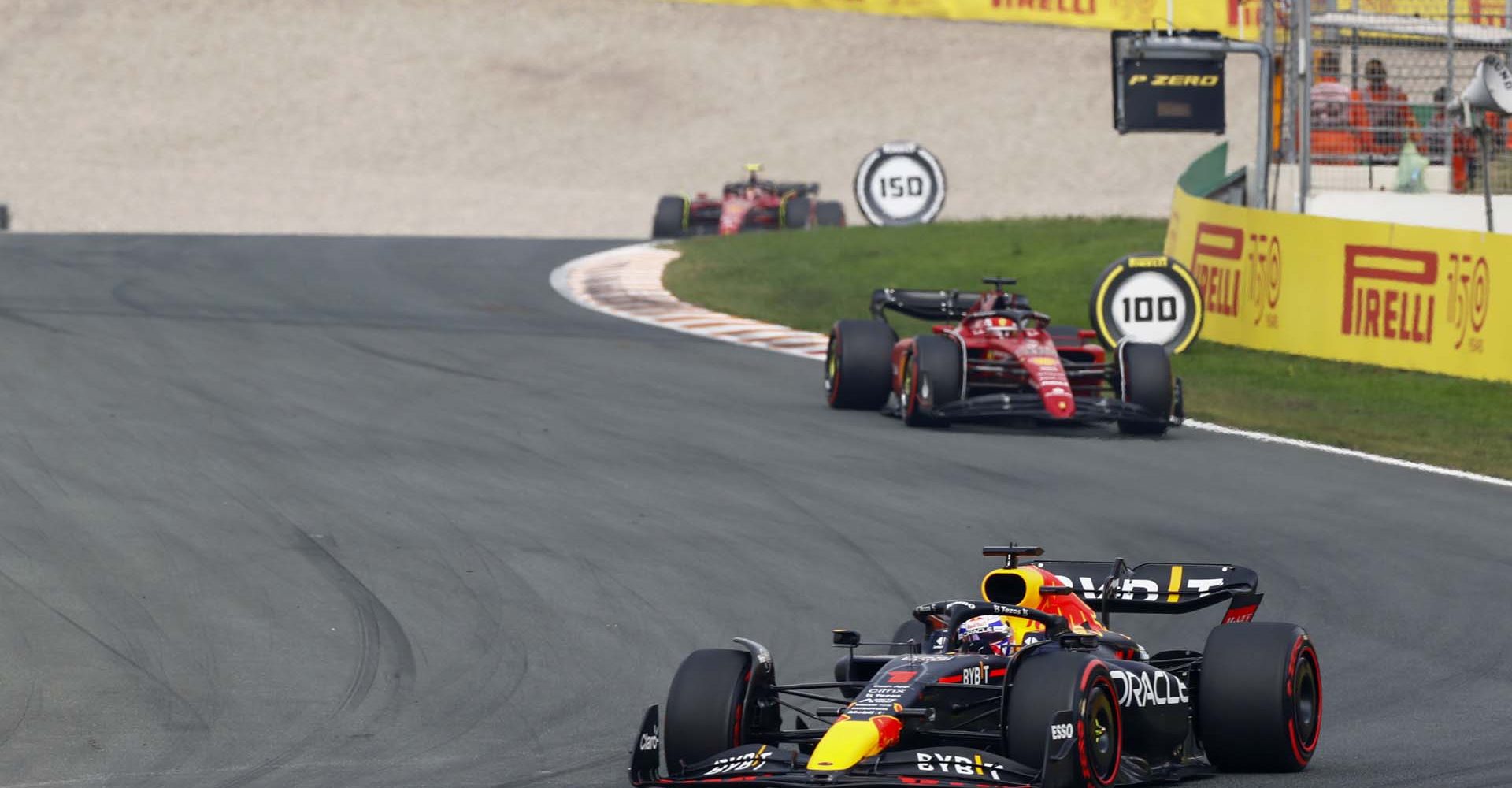 CIRCUIT ZANDVOORT, NETHERLANDS - SEPTEMBER 04: Max Verstappen, Red Bull Racing RB18, leads Charles Leclerc, Ferrari F1-75, and Carlos Sainz, Ferrari F1-75 during the Dutch GP at Circuit Zandvoort on Sunday September 04, 2022 in North Holland, Netherlands. (Photo by Alastair Staley / LAT Images)