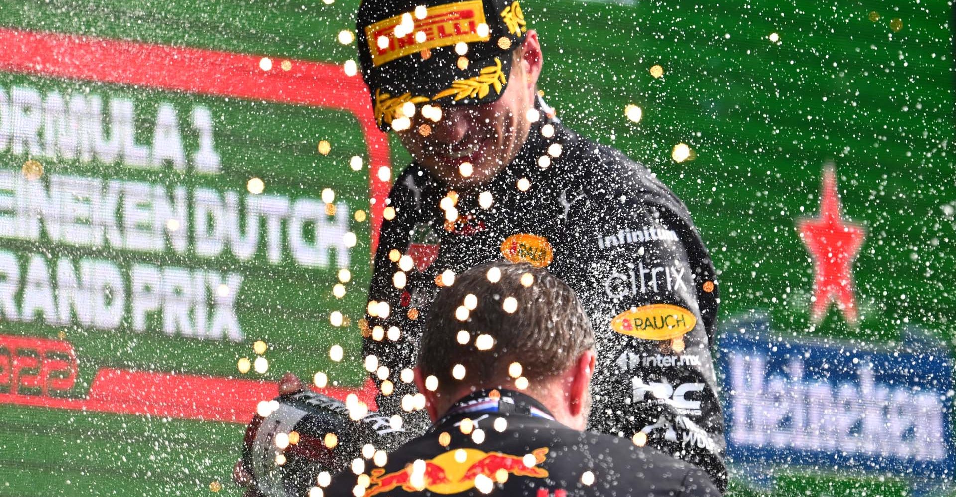 ZANDVOORT, NETHERLANDS - SEPTEMBER 04: Race winner Max Verstappen of the Netherlands and Oracle Red Bull Racing celebrates on the podium during the F1 Grand Prix of The Netherlands at Circuit Zandvoort on September 04, 2022 in Zandvoort, Netherlands. (Photo by Clive Mason/Getty Images)