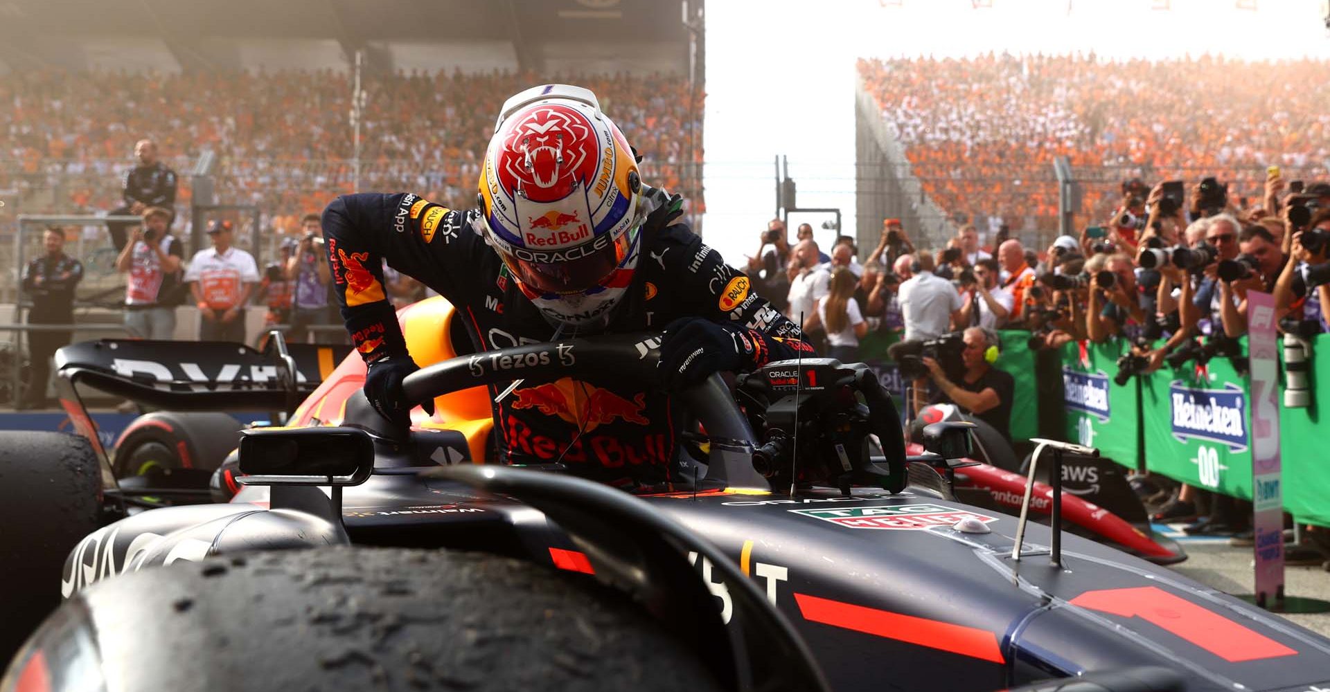 ZANDVOORT, NETHERLANDS - SEPTEMBER 04: Race winner Max Verstappen of the Netherlands and Oracle Red Bull Racing climbs out of their car in parc ferme during the F1 Grand Prix of The Netherlands at Circuit Zandvoort on September 04, 2022 in Zandvoort, Netherlands. (Photo by Mark Thompson/Getty Images)