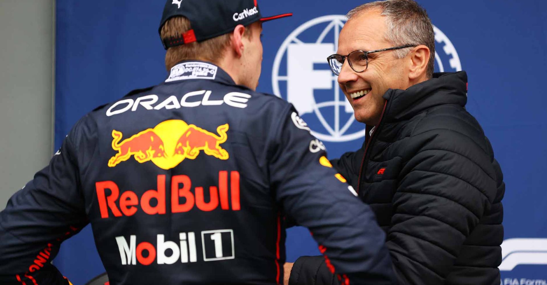 IMOLA, ITALY - APRIL 22: Pole position qualifier Max Verstappen of the Netherlands and Oracle Red Bull Racing collects his Pole Position award from Stefano Domenicali, CEO of the Formula One Group, in parc ferme during qualifying ahead of the F1 Grand Prix of Emilia Romagna at Autodromo Enzo e Dino Ferrari on April 22, 2022 in Imola, Italy. (Photo by Dan Mullan/Getty Images)