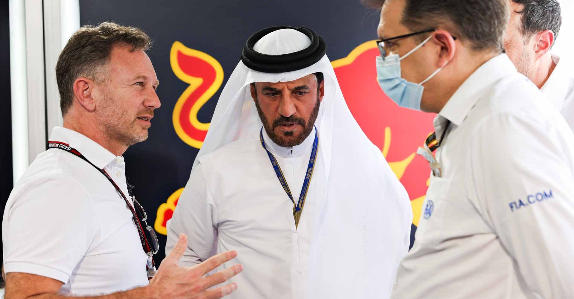 BAHRAIN, BAHRAIN - MARCH 11: Red Bull Racing Team Principal Christian Horner (L) talks with Mohammed ben Sulayem, FIA President, (C) during Day Two of F1 Testing at Bahrain International Circuit on March 11, 2022 in Bahrain, Bahrain. (Photo by Mark Thompson/Getty Images)