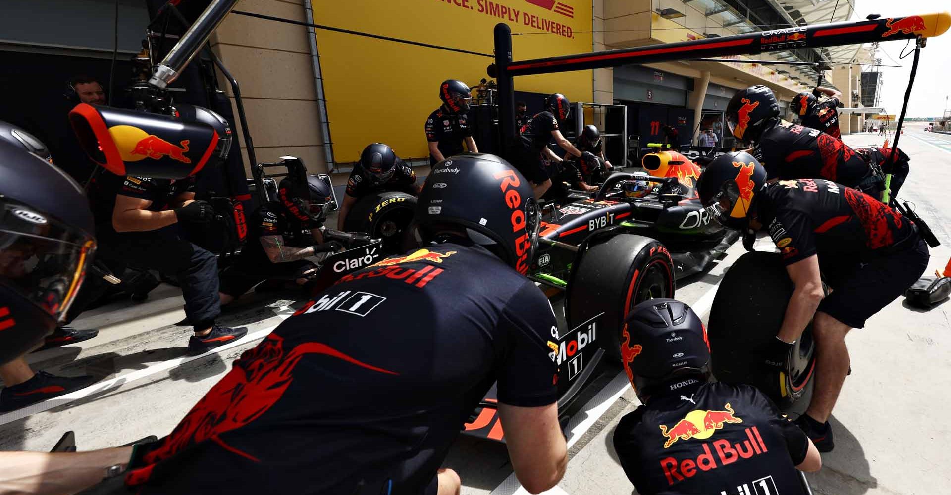 BAHRAIN, BAHRAIN - MARCH 12: Sergio Perez of Mexico driving the (11) Oracle Red Bull Racing RB18 makes a pitstop during Day Three of F1 Testing at Bahrain International Circuit on March 12, 2022 in Bahrain, Bahrain. (Photo by Mark Thompson/Getty Images)