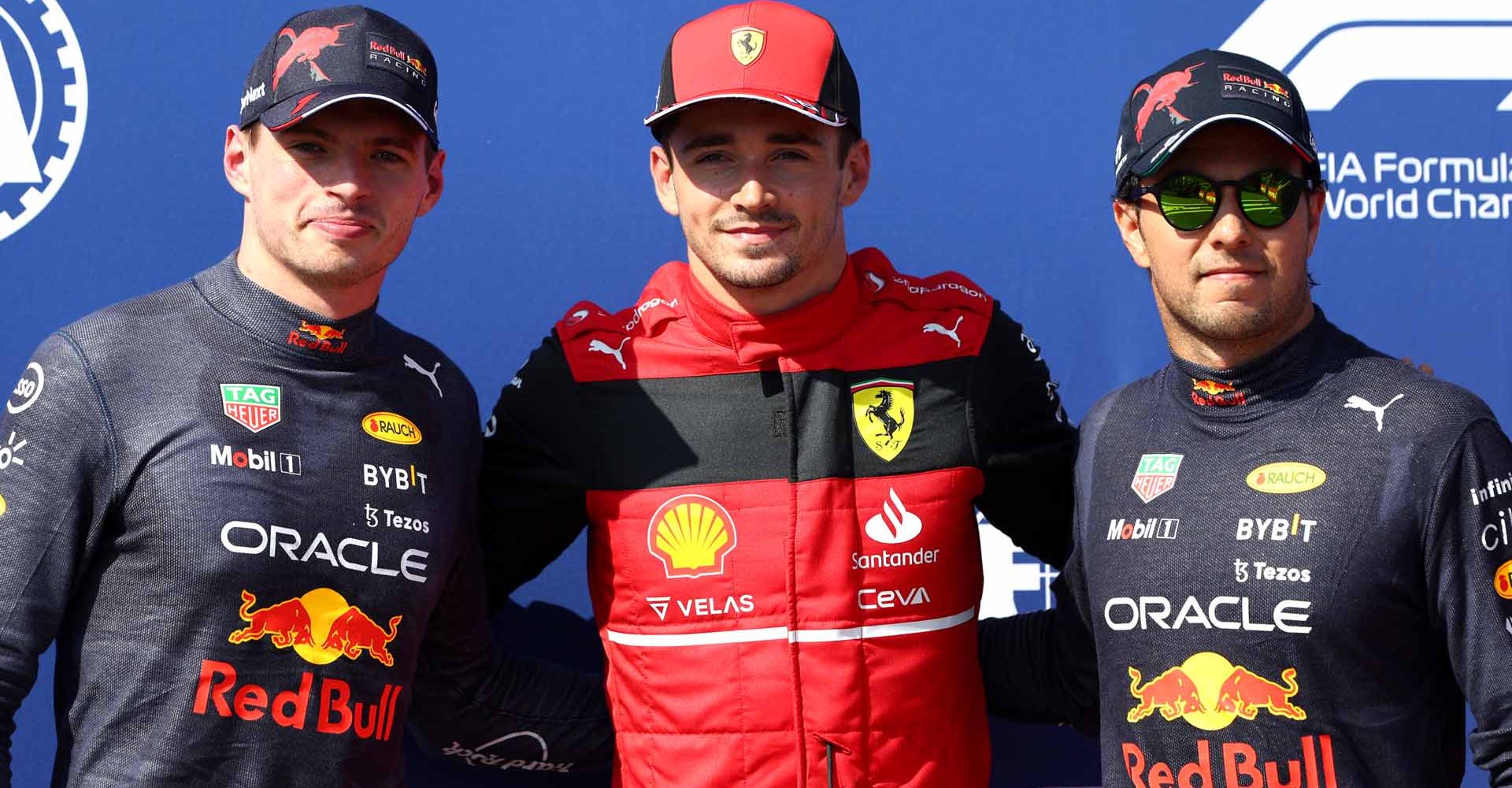 LE CASTELLET, FRANCE - JULY 23: Pole position qualifier Charles Leclerc of Monaco and Ferrari (C), Second placed qualifier Max Verstappen of the Netherlands and Oracle Red Bull Racing (L) and Third placed qualifier Sergio Perez of Mexico and Oracle Red Bull Racing (R) pose for a photo in parc ferme during qualifying ahead of the F1 Grand Prix of France at Circuit Paul Ricard on July 23, 2022 in Le Castellet, France. (Photo by Clive Rose/Getty Images)