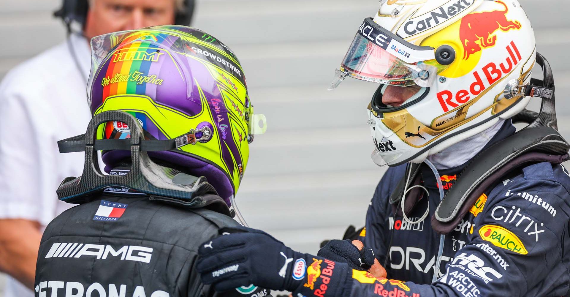 BUDAPEST, HUNGARY - JULY 31: Lewis Hamilton of Mercedes and Great Britain congratulates Max Verstappen of Red Bull Racing and The Netherlands on finishing in first position during the F1 Grand Prix of Hungary at Hungaroring on July 31, 2022 in Budapest, Hungary. (Photo by Peter Fox/Getty Images)