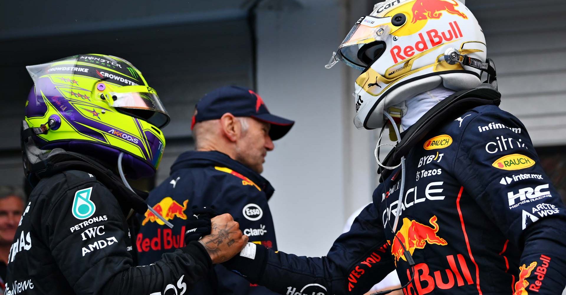 BUDAPEST, HUNGARY - JULY 31: Race winner Max Verstappen of the Netherlands and Oracle Red Bull Racing and Second placed Lewis Hamilton of Great Britain and Mercedes shake hands in parc ferme during the F1 Grand Prix of Hungary at Hungaroring on July 31, 2022 in Budapest, Hungary. (Photo by Dan Mullan/Getty Images)