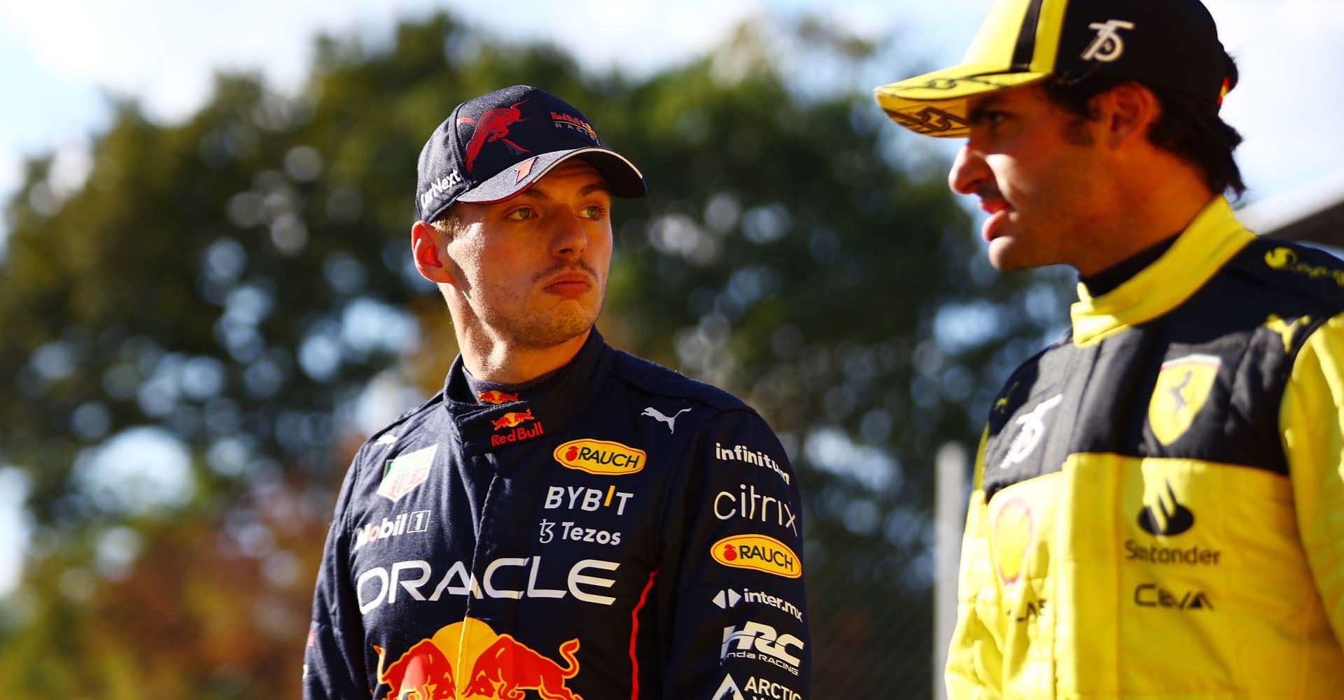 MONZA, ITALY - SEPTEMBER 10: Third placed qualifier Carlos Sainz of Spain and Ferrari and Second placed qualifier Max Verstappen of the Netherlands and Oracle Red Bull Racing look on in parc ferme during qualifying ahead of the F1 Grand Prix of Italy at Autodromo Nazionale Monza on September 10, 2022 in Monza, Italy. (Photo by Mark Thompson/Getty Images)