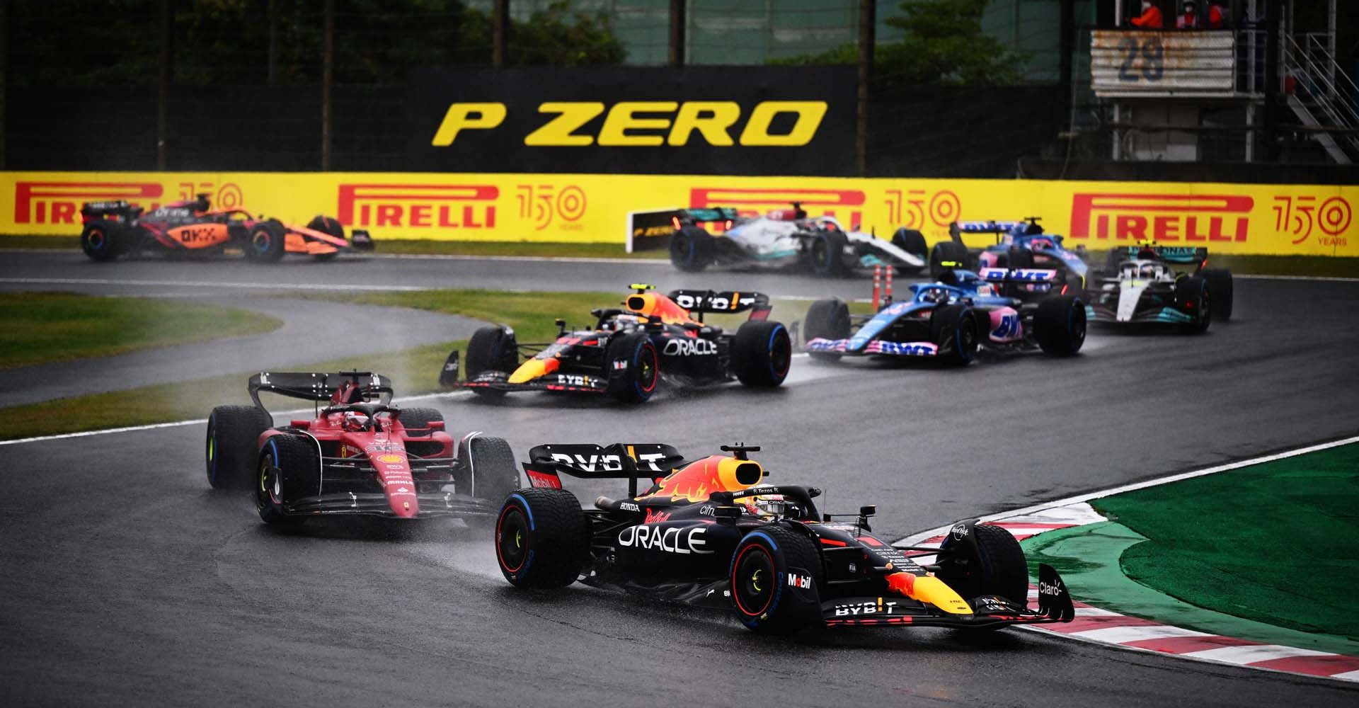 SUZUKA, JAPAN - OCTOBER 09: Max Verstappen of the Netherlands driving the (1) Oracle Red Bull Racing RB18 leads Charles Leclerc of Monaco driving the (16) Ferrari F1-75 during the F1 Grand Prix of Japan at Suzuka International Racing Course on October 09, 2022 in Suzuka, Japan. (Photo by Clive Mason/Getty Images)