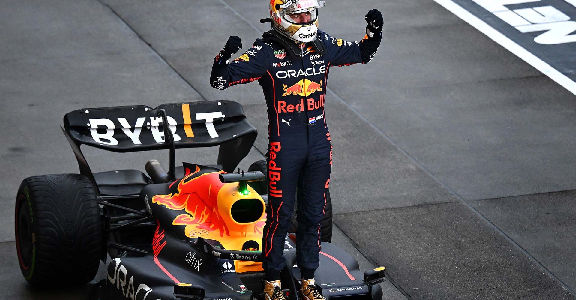 SUZUKA, JAPAN - OCTOBER 09: Race winner and 2022 F1 World Drivers Champion Max Verstappen of Netherlands and Oracle Red Bull Racing celebrates in parc ferme during the F1 Grand Prix of Japan at Suzuka International Racing Course on October 09, 2022 in Suzuka, Japan. (Photo by Clive Mason/Getty Images)