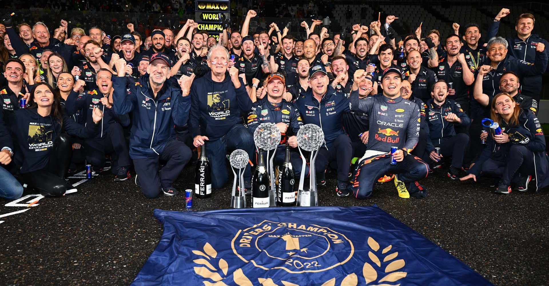 SUZUKA, JAPAN - OCTOBER 09: Race winner and 2022 F1 World Drivers Champion Max Verstappen of Netherlands and Oracle Red Bull Racing celebrates with his team after the F1 Grand Prix of Japan at Suzuka International Racing Course on October 09, 2022 in Suzuka, Japan. (Photo by Clive Mason/Getty Images)