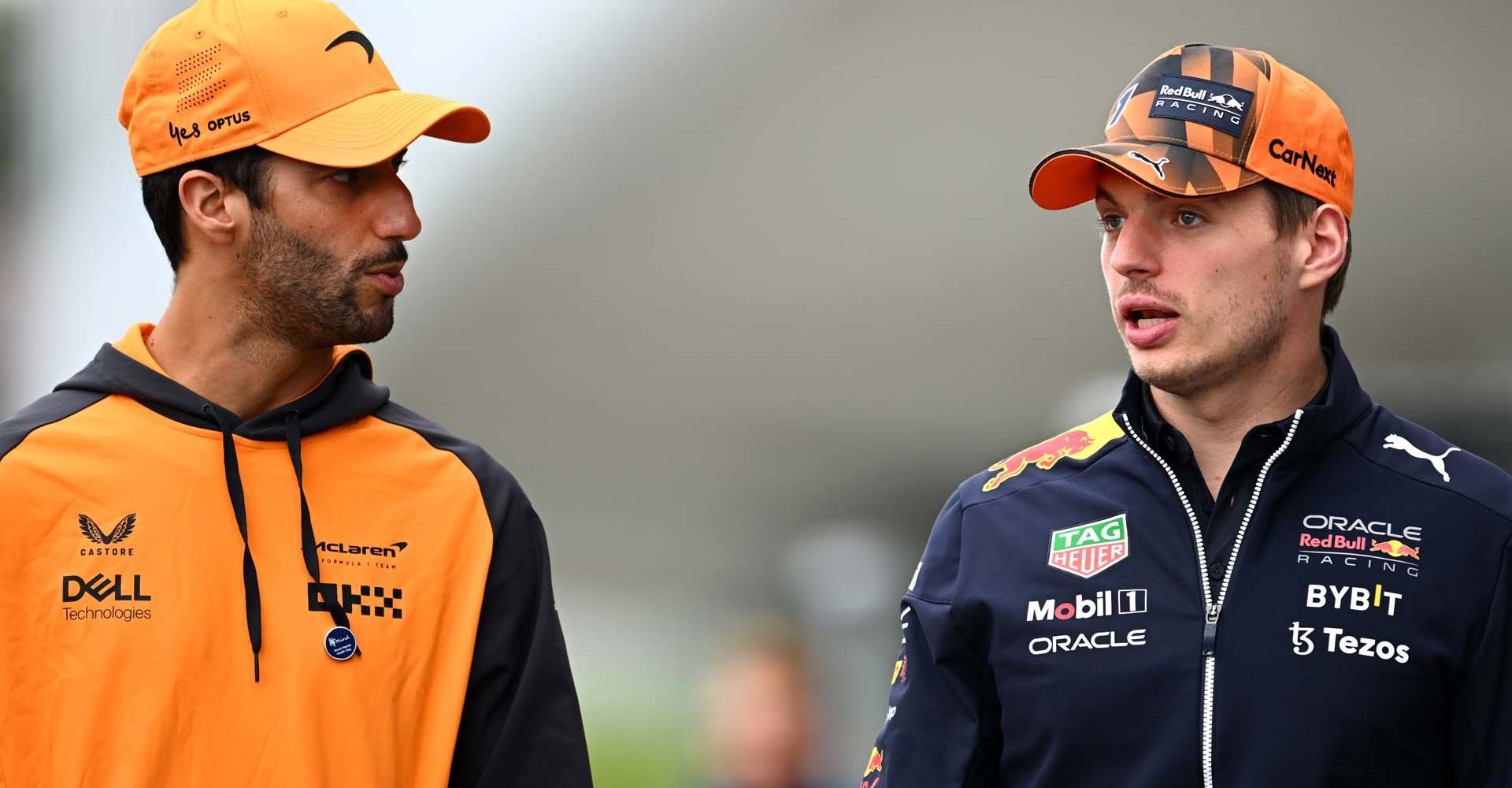 SUZUKA, JAPAN - OCTOBER 06: Max Verstappen of the Netherlands and Oracle Red Bull Racing and Daniel Ricciardo of Australia and McLaren talk in the Paddock during previews ahead of the F1 Grand Prix of Japan at Suzuka International Racing Course on October 06, 2022 in Suzuka, Japan. (Photo by Clive Mason/Getty Images)