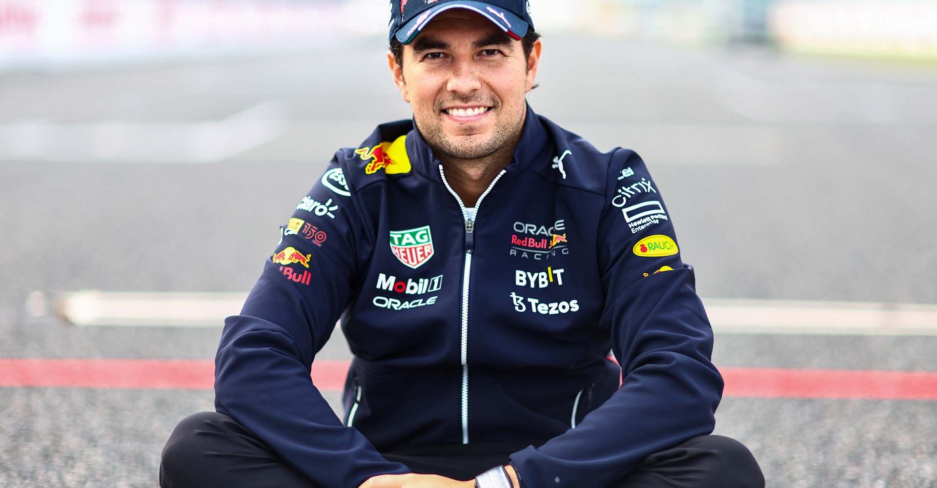 SUZUKA, JAPAN - OCTOBER 06: Sergio Perez of Mexico and Oracle Red Bull Racing poses for a photo during previews ahead of the F1 Grand Prix of Japan at Suzuka International Racing Course on October 06, 2022 in Suzuka, Japan. (Photo by Mark Thompson/Getty Images )