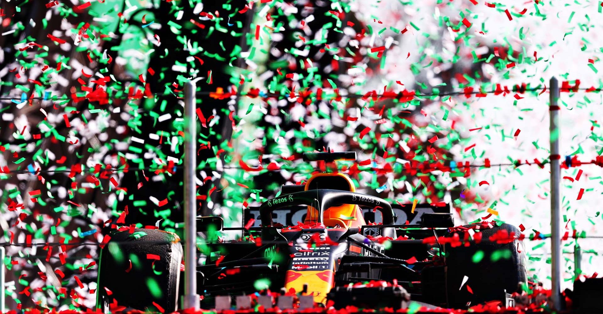 MEXICO CITY, MEXICO - NOVEMBER 07: The car of race winner Max Verstappen of Netherlands and Red Bull Racing is raised onto the podium during the prize presentation ceremony after the F1 Grand Prix of Mexico at Autodromo Hermanos Rodriguez on November 07, 2021 in Mexico City, Mexico. (Photo by Lars Baron/Getty Images)