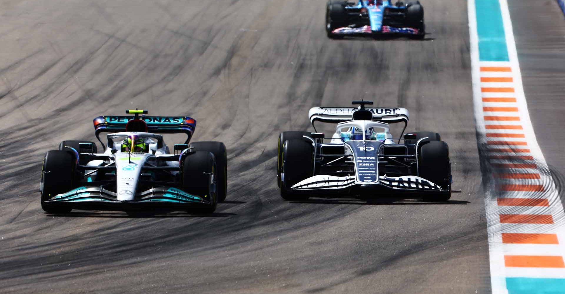 MIAMI, FLORIDA - MAY 08: Lewis Hamilton of Great Britain driving the (44) Mercedes AMG Petronas F1 Team W13 and Pierre Gasly of France driving the (10) Scuderia AlphaTauri AT03 battle for track position during the F1 Grand Prix of Miami at the Miami International Autodrome on May 08, 2022 in Miami, Florida. (Photo by Mark Thompson/Getty Images)