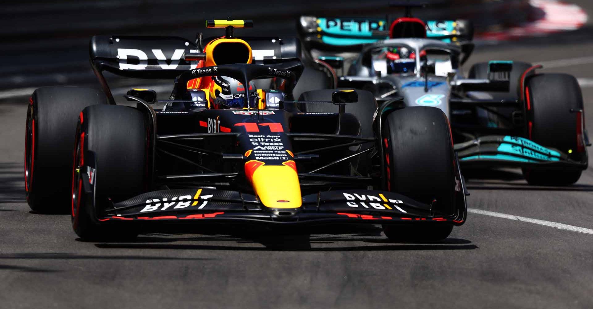 MONTE-CARLO, MONACO - MAY 28: Sergio Perez of Mexico driving the (11) Oracle Red Bull Racing RB18 leads George Russell of Great Britain driving the (63) Mercedes AMG Petronas F1 Team W13 during final practice ahead of the F1 Grand Prix of Monaco at Circuit de Monaco on May 28, 2022 in Monte-Carlo, Monaco. (Photo by Clive Rose/Getty Images)