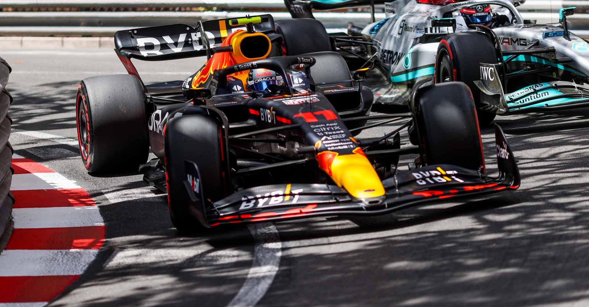 MONTE-CARLO, MONACO - MAY 28: Sergio Perez of Mexico and Red Bull Racing and George Russell of Mercedes and Great Britain  during qualifying ahead of the F1 Grand Prix of Monaco at Circuit de Monaco on May 28, 2022 in Monte-Carlo, Monaco. (Photo by Peter Fox/Getty Images)