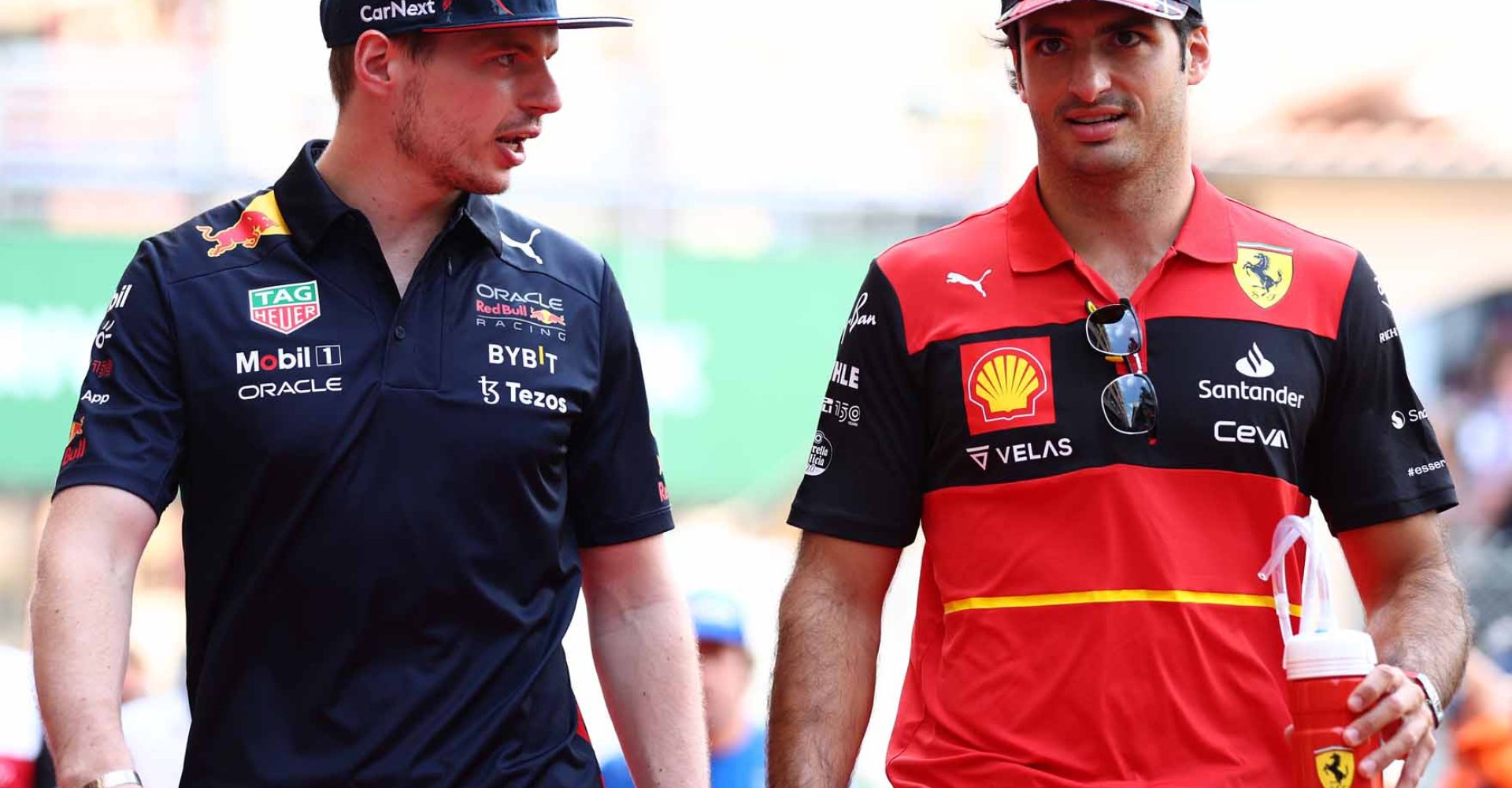 MONTE-CARLO, MONACO - MAY 29: Max Verstappen of the Netherlands and Oracle Red Bull Racing and Carlos Sainz of Spain and Ferrari talk in the Paddock ahead of the F1 Grand Prix of Monaco at Circuit de Monaco on May 29, 2022 in Monte-Carlo, Monaco. (Photo by Clive Rose/Getty Images)