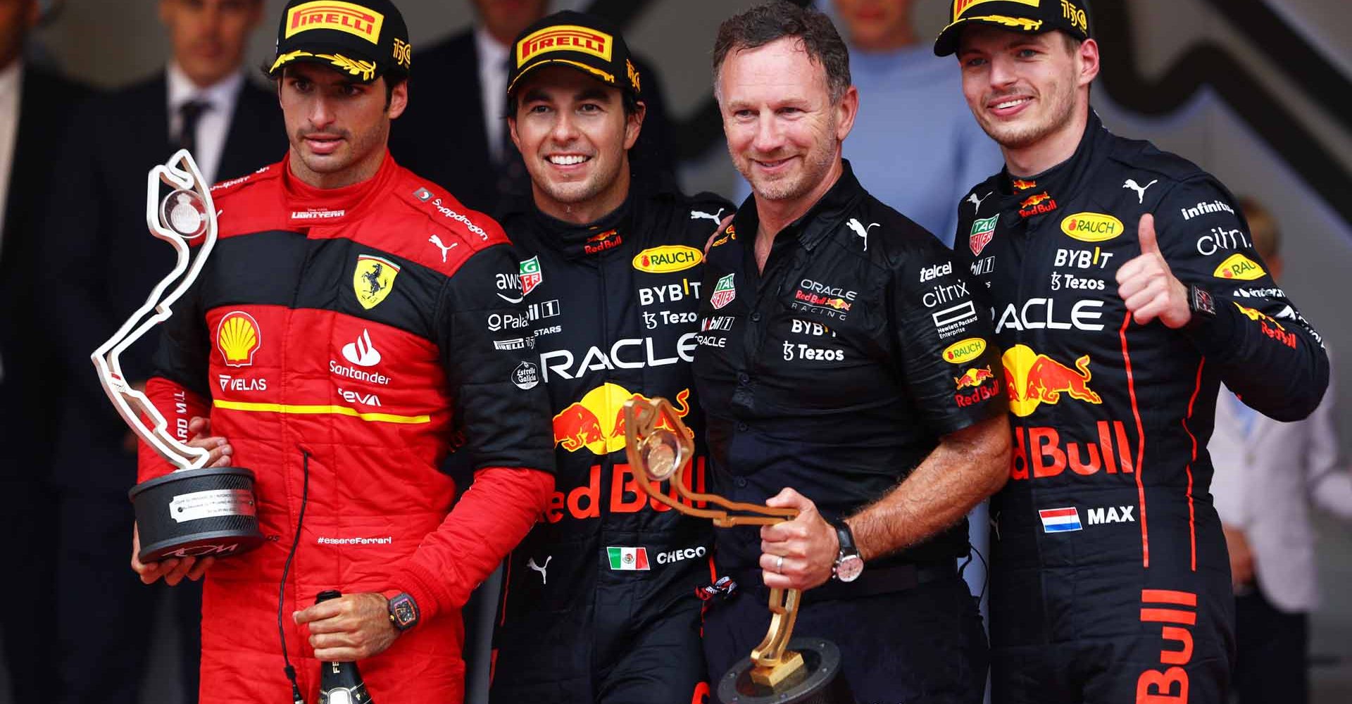 MONTE-CARLO, MONACO - MAY 29: Race winner Sergio Perez of Mexico and Oracle Red Bull Racing, Second placed Carlos Sainz of Spain and Ferrari, Third placed Max Verstappen of the Netherlands and Oracle Red Bull Racing and Red Bull Racing Team Principal Christian Horner celebrate on the podium during the F1 Grand Prix of Monaco at Circuit de Monaco on May 29, 2022 in Monte-Carlo, Monaco. (Photo by Clive Rose/Getty Images)