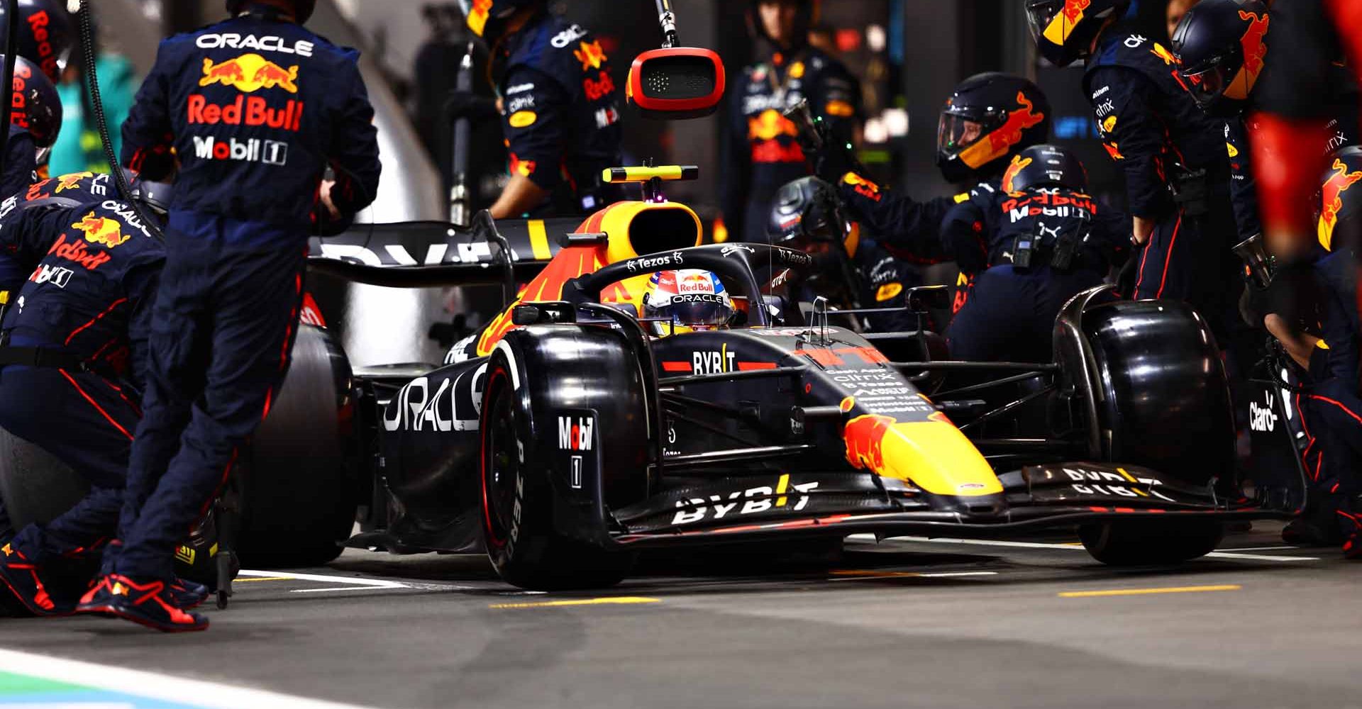 JEDDAH, SAUDI ARABIA - MARCH 27: Sergio Perez of Mexico driving the (11) Oracle Red Bull Racing RB18 makes a pitstop during the F1 Grand Prix of Saudi Arabia at the Jeddah Corniche Circuit on March 27, 2022 in Jeddah, Saudi Arabia. (Photo by Mark Thompson/Getty Images)